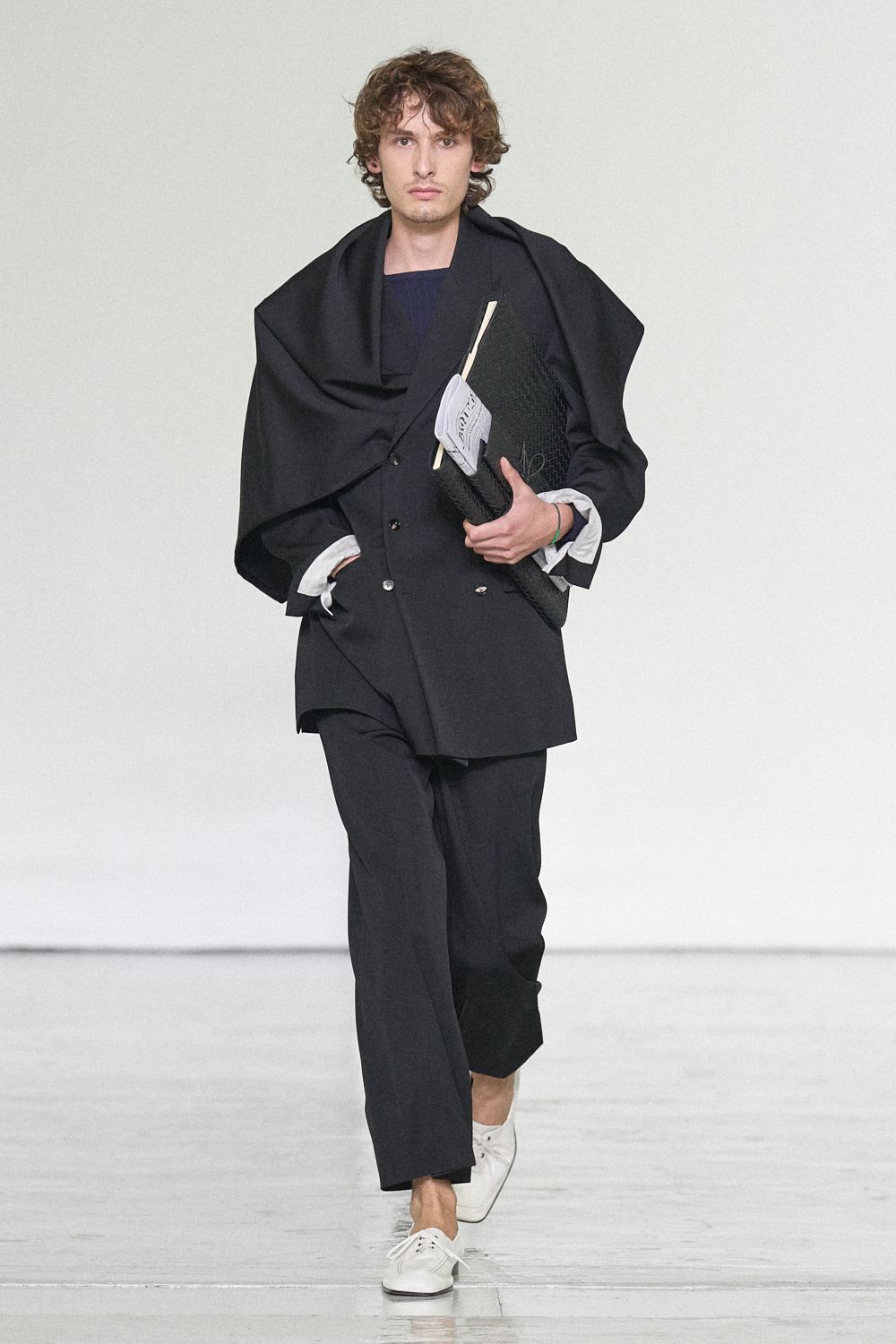 black double-breasted blazer with draped cape