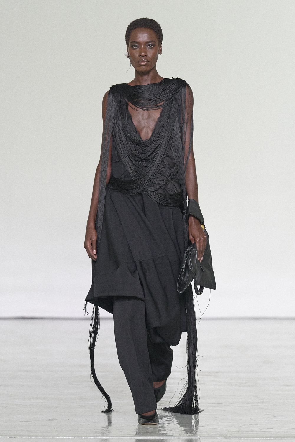 black fringe-draped sleeveless top