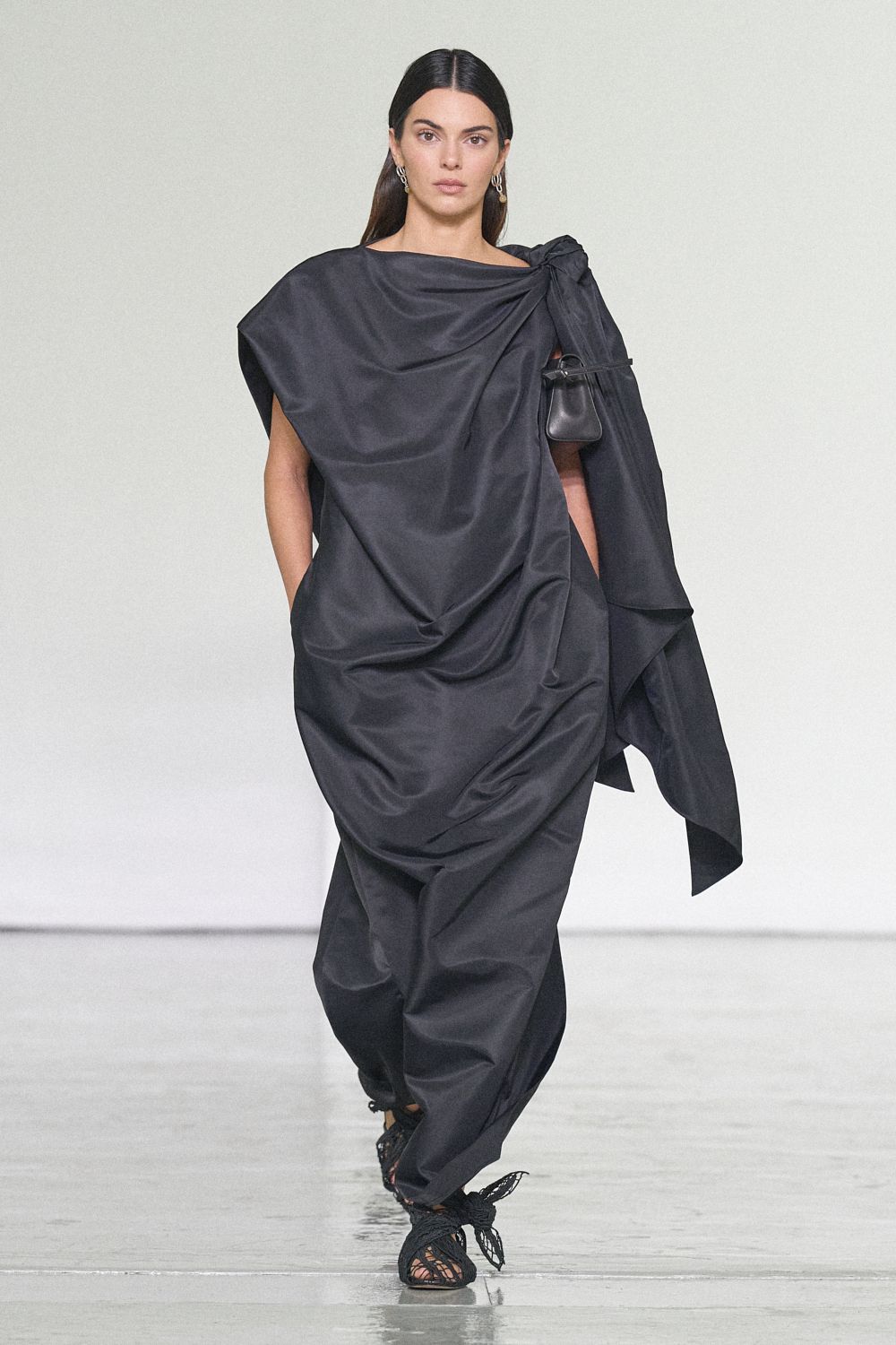black draped asymmetric evening gown
