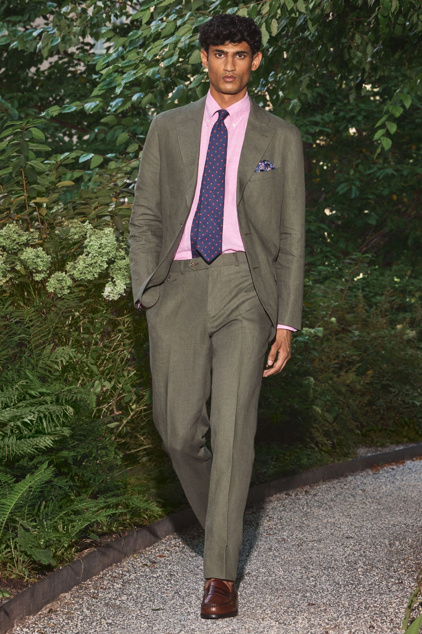 olive tailored suit with pink shirt