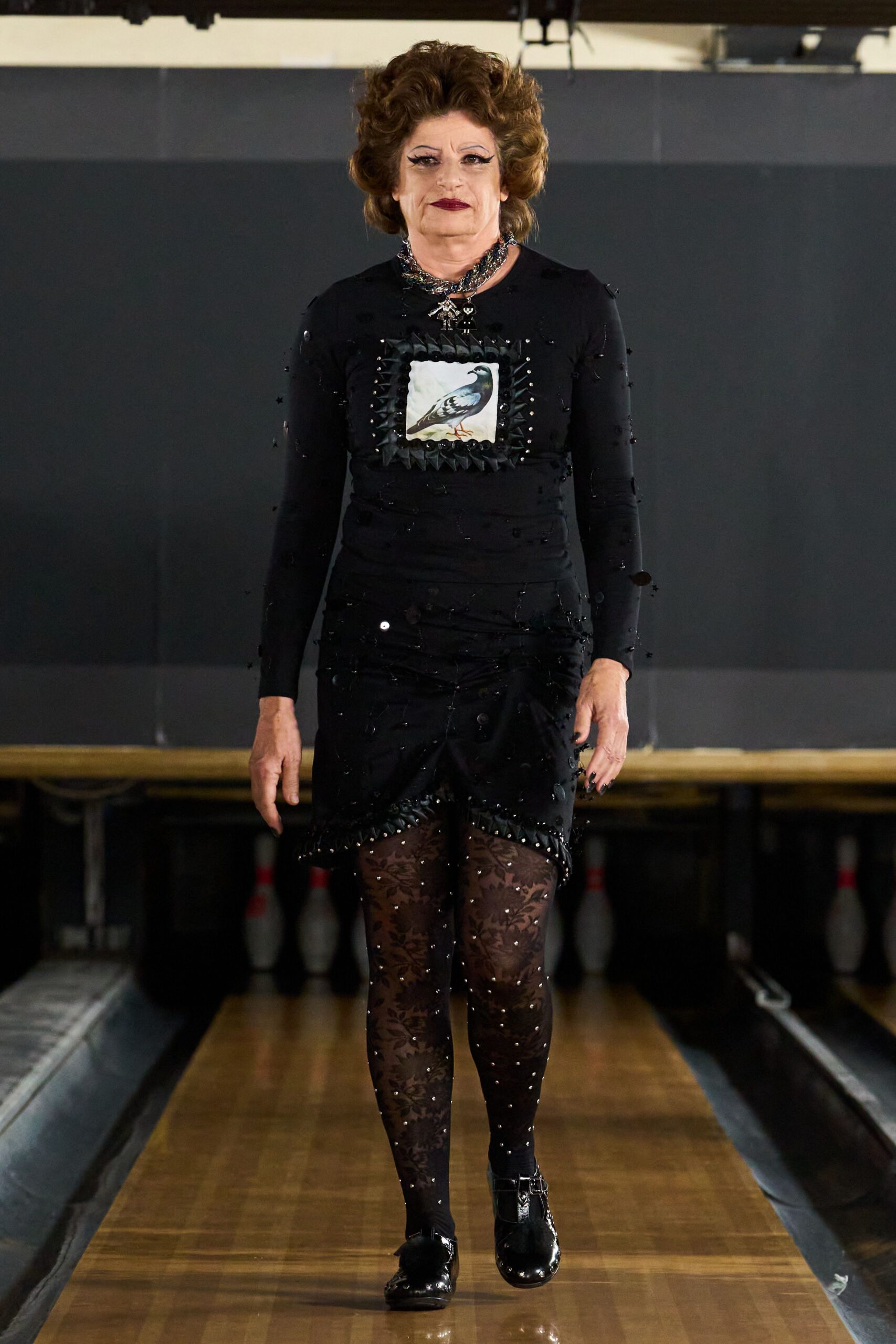 black mini dress with bird motif