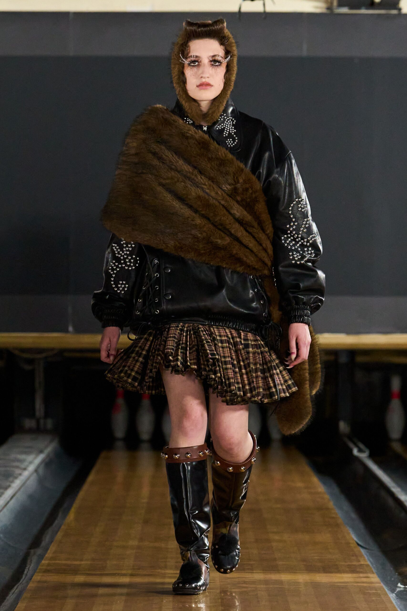 fur stole over leather bomber jacket