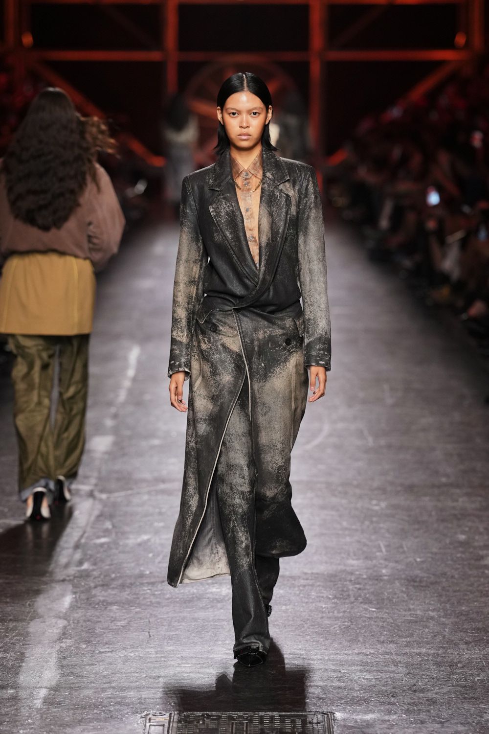Sheer taupe shirt unbuttoned low, with a smoky mottled finish. Black wrap coat dusted to ash at the sleeves and skewed hem. Matching straight trousers, faded pale through the thighs and shin. Square black toes peeking out. Whatever you wear back from the kiln yard after dark.