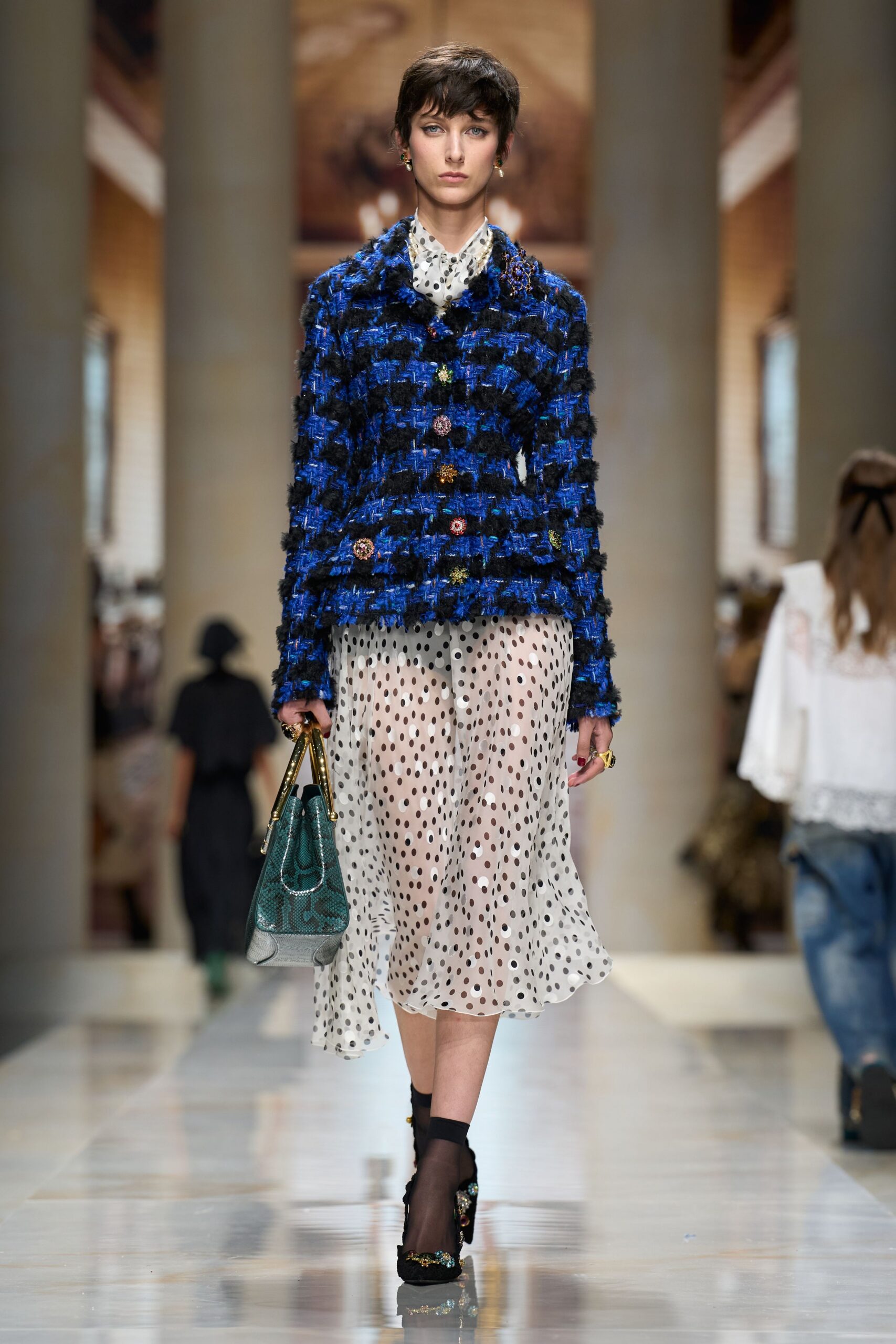 blue boucle jacket over polka-dot dress