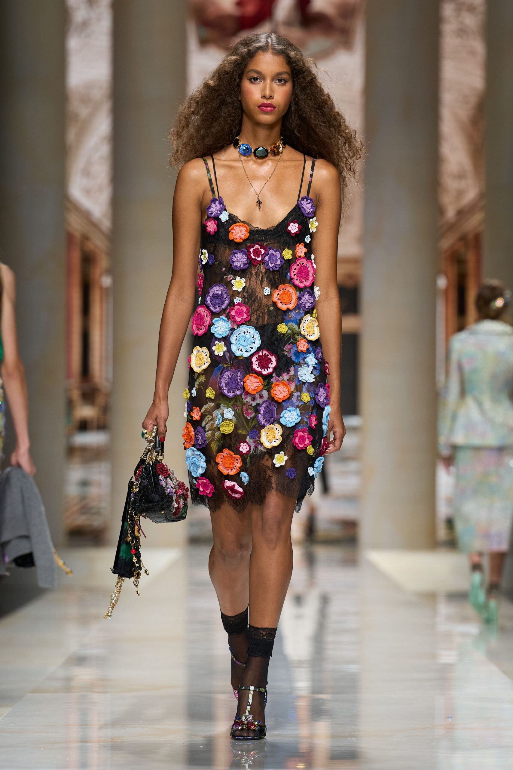 black lace slip dress with crocheted flowers