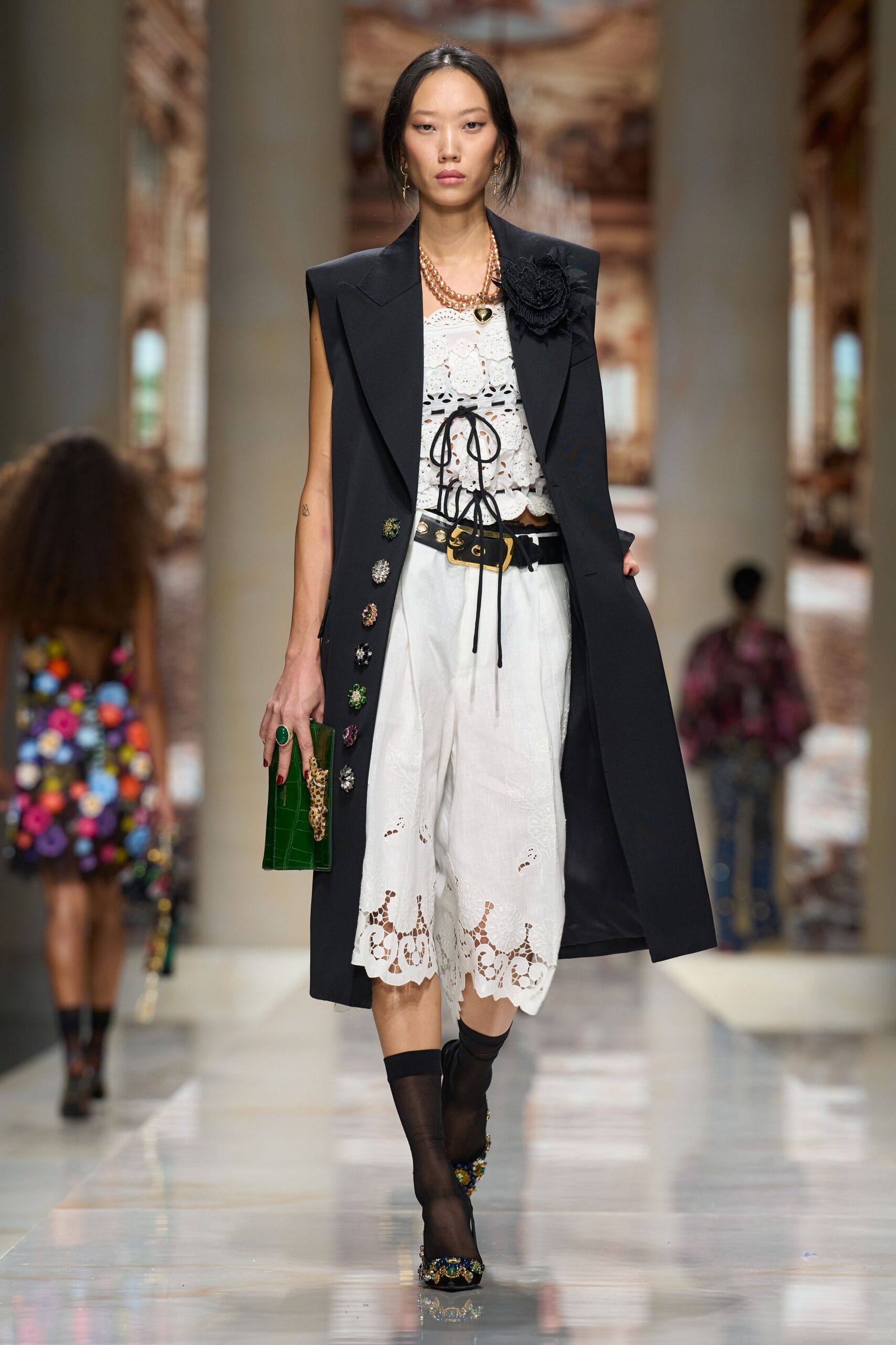 black sleeveless embellished overcoat