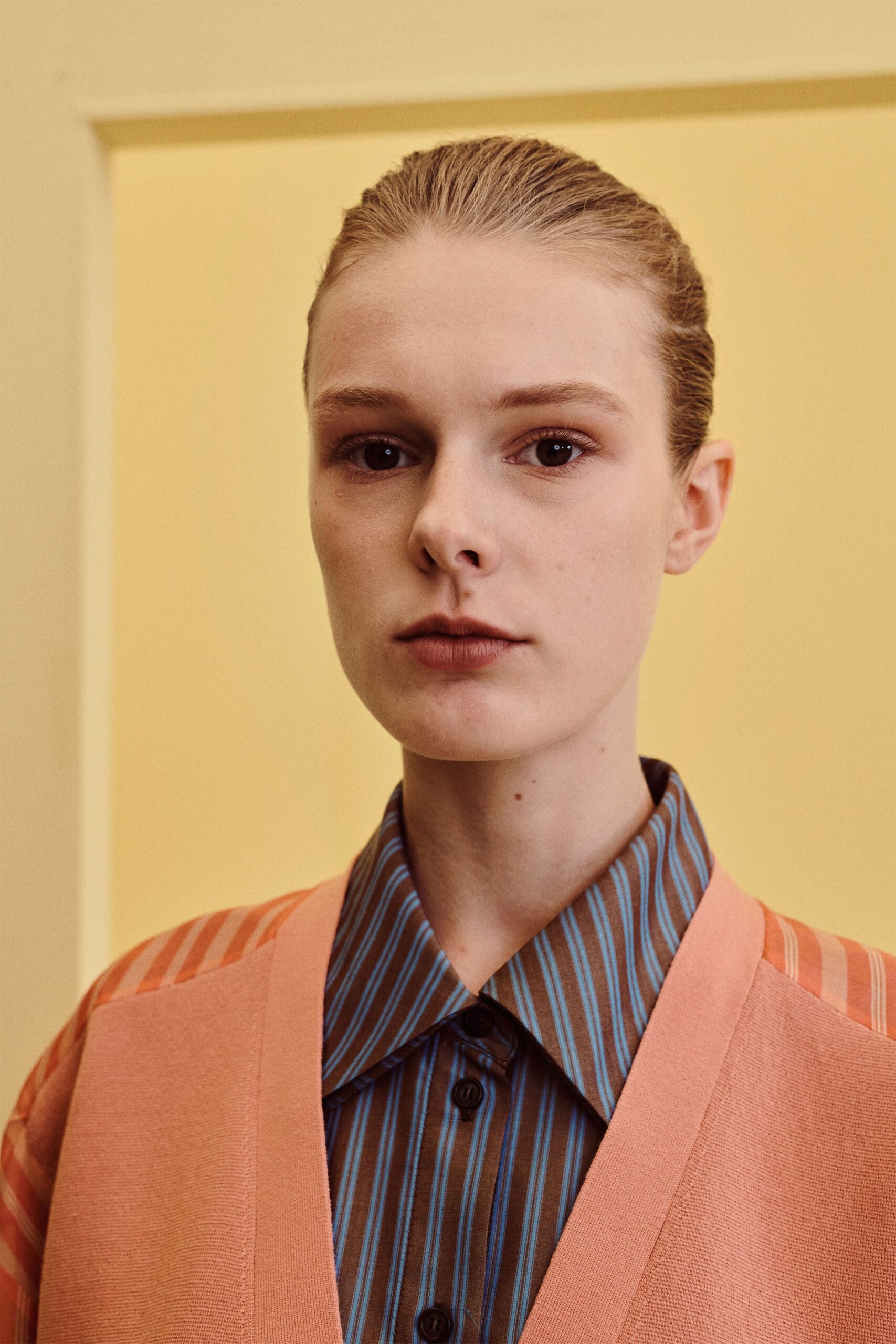 striped collared shirt under cardigan