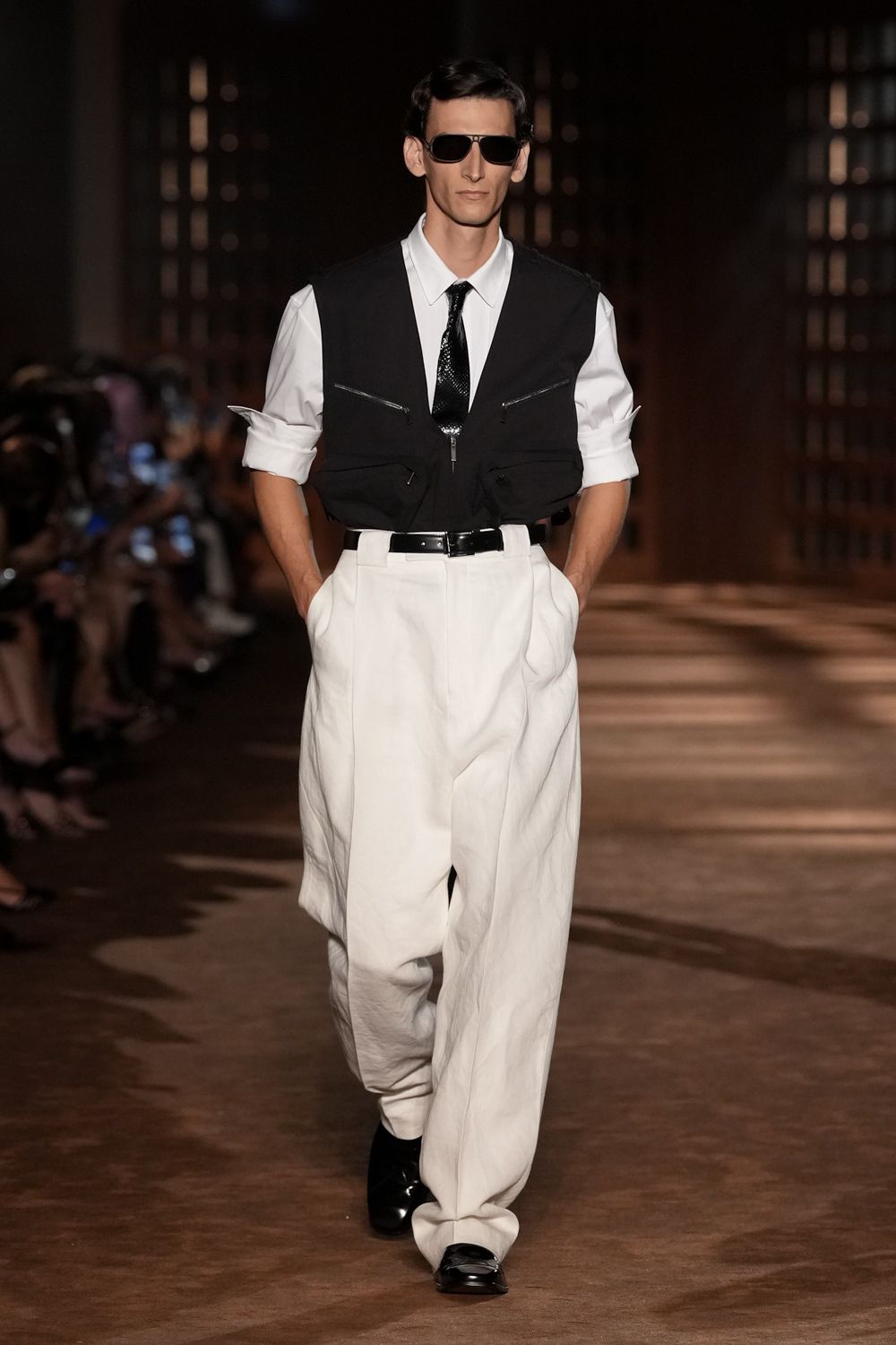 cropped utility vest with wide-leg trousers