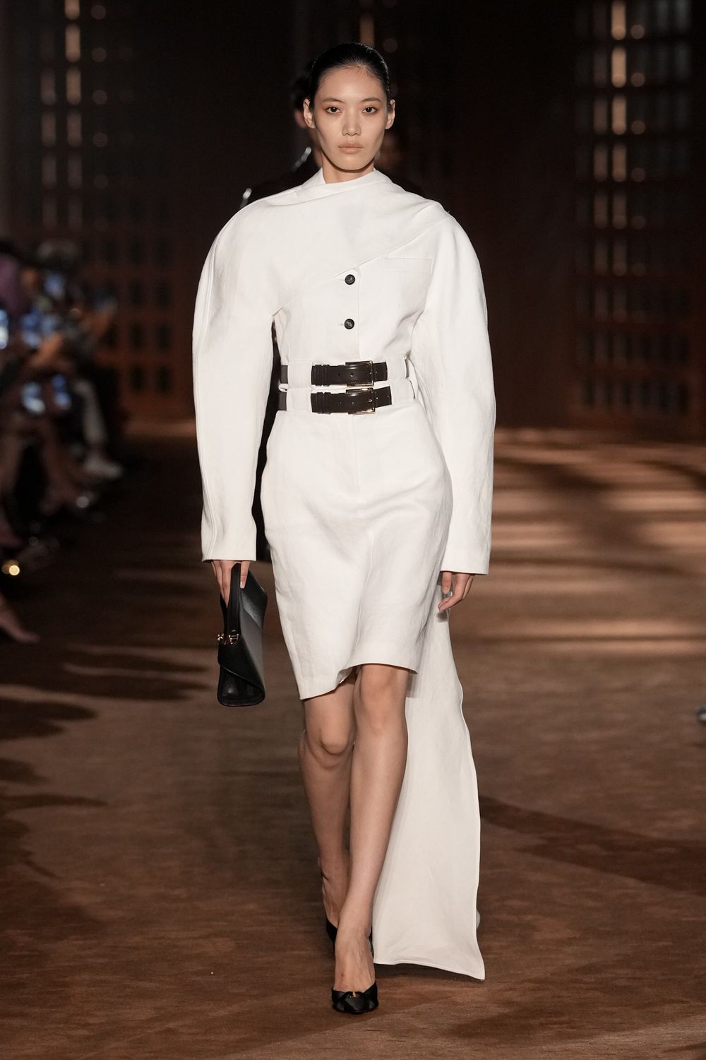 white asymmetric belted dress with train