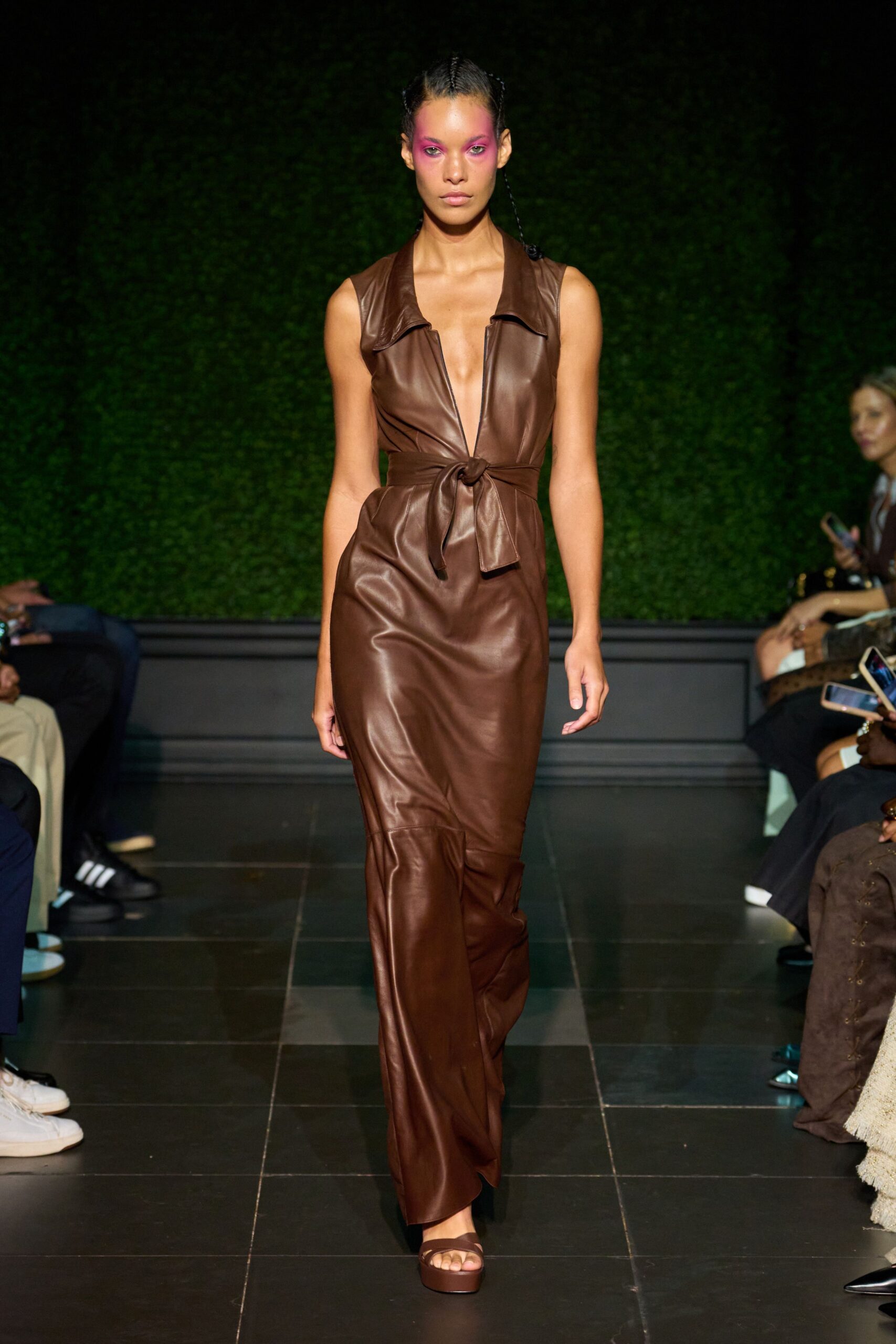 Chocolate brown leather column dress, plunging open neck and self-tie knot at the waist. Matching brown leather platforms with a broad toe strap. For drinks on a terrace after the heat still hasn't broken.