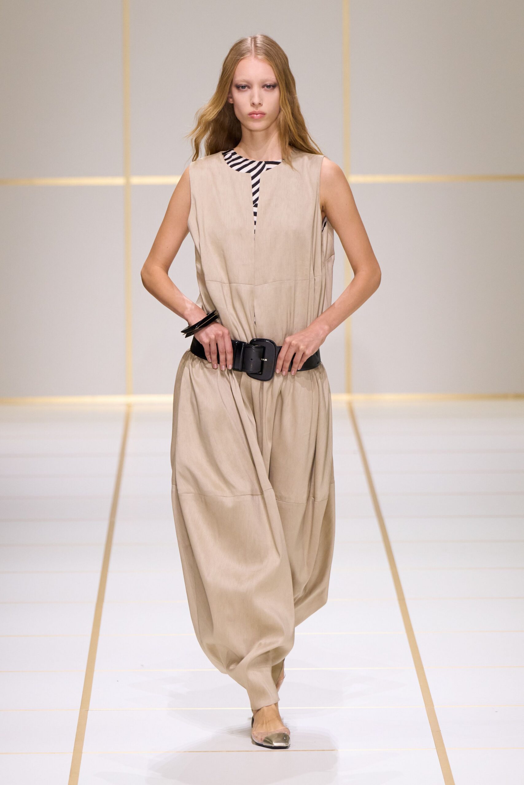 beige sleeveless high-neck relaxed draped belted flowing jumpsuit