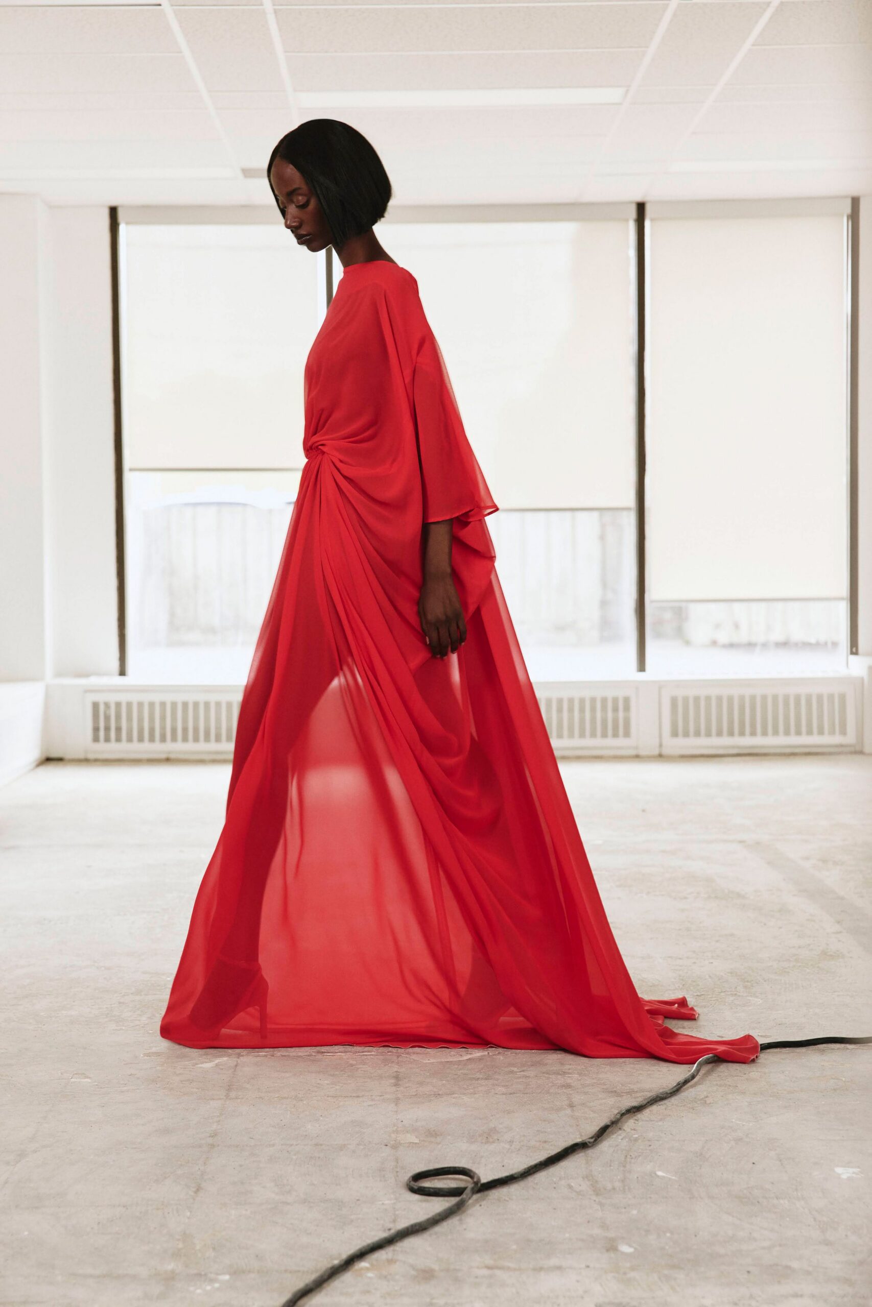 red draped chiffon evening gown