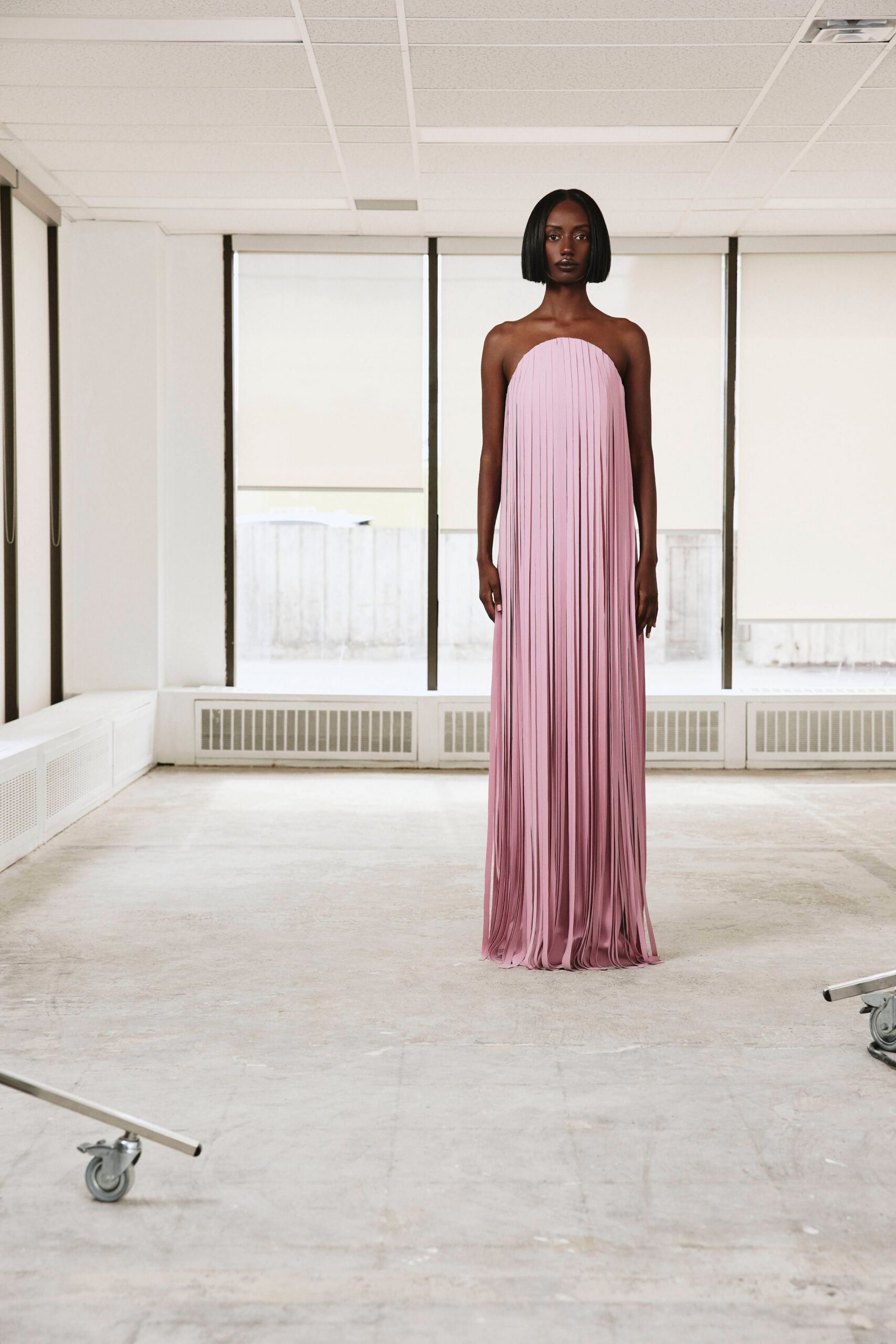 strapless pleated pink evening gown