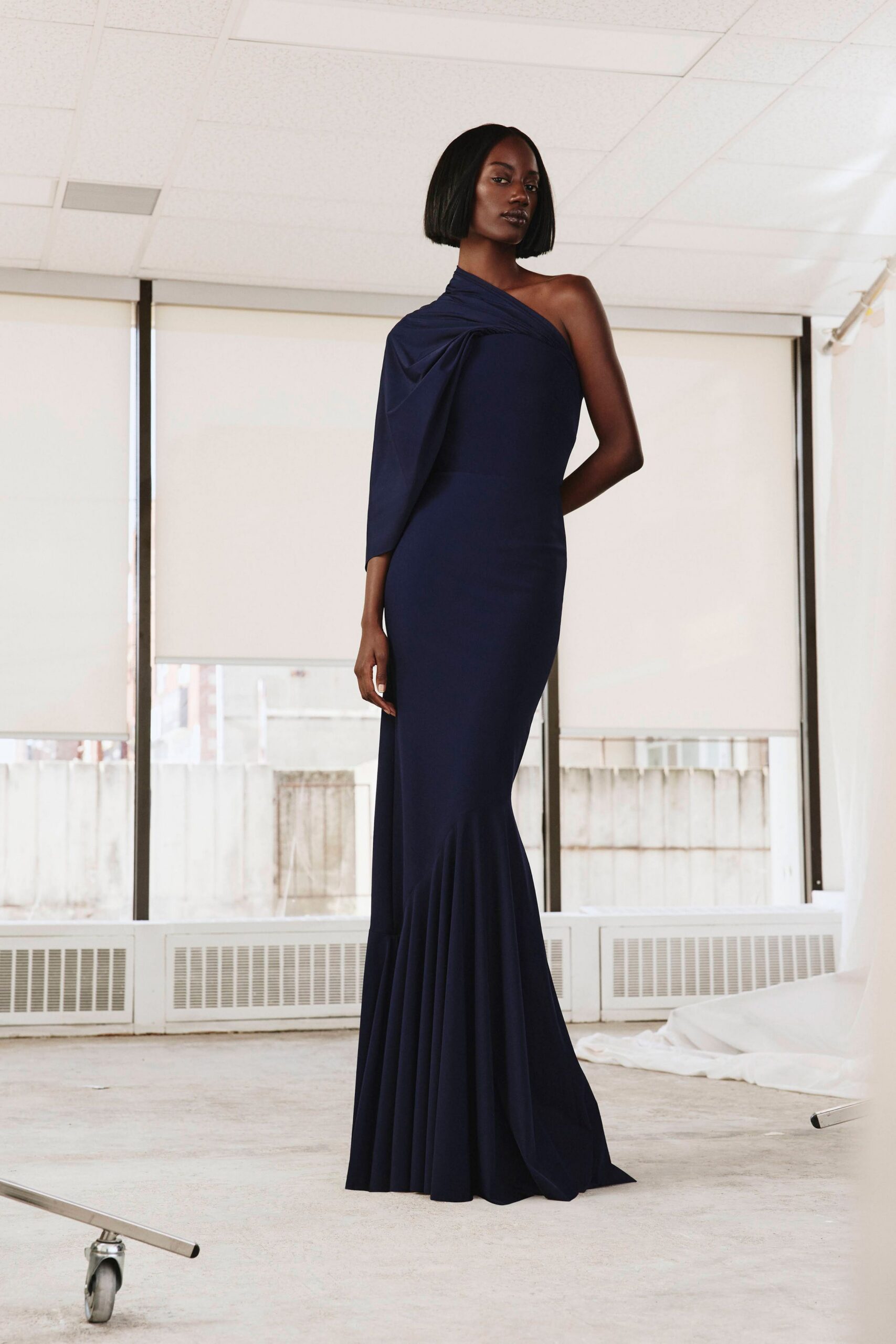 navy one-shoulder draped evening gown