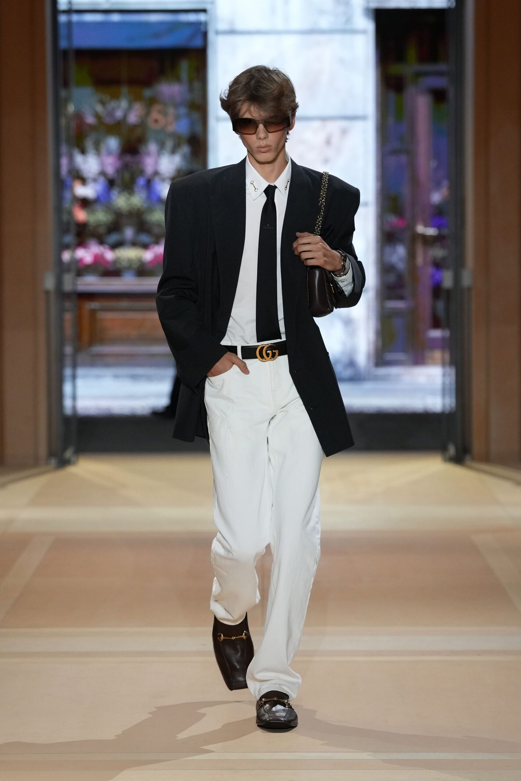 oversized black blazer with white trousers