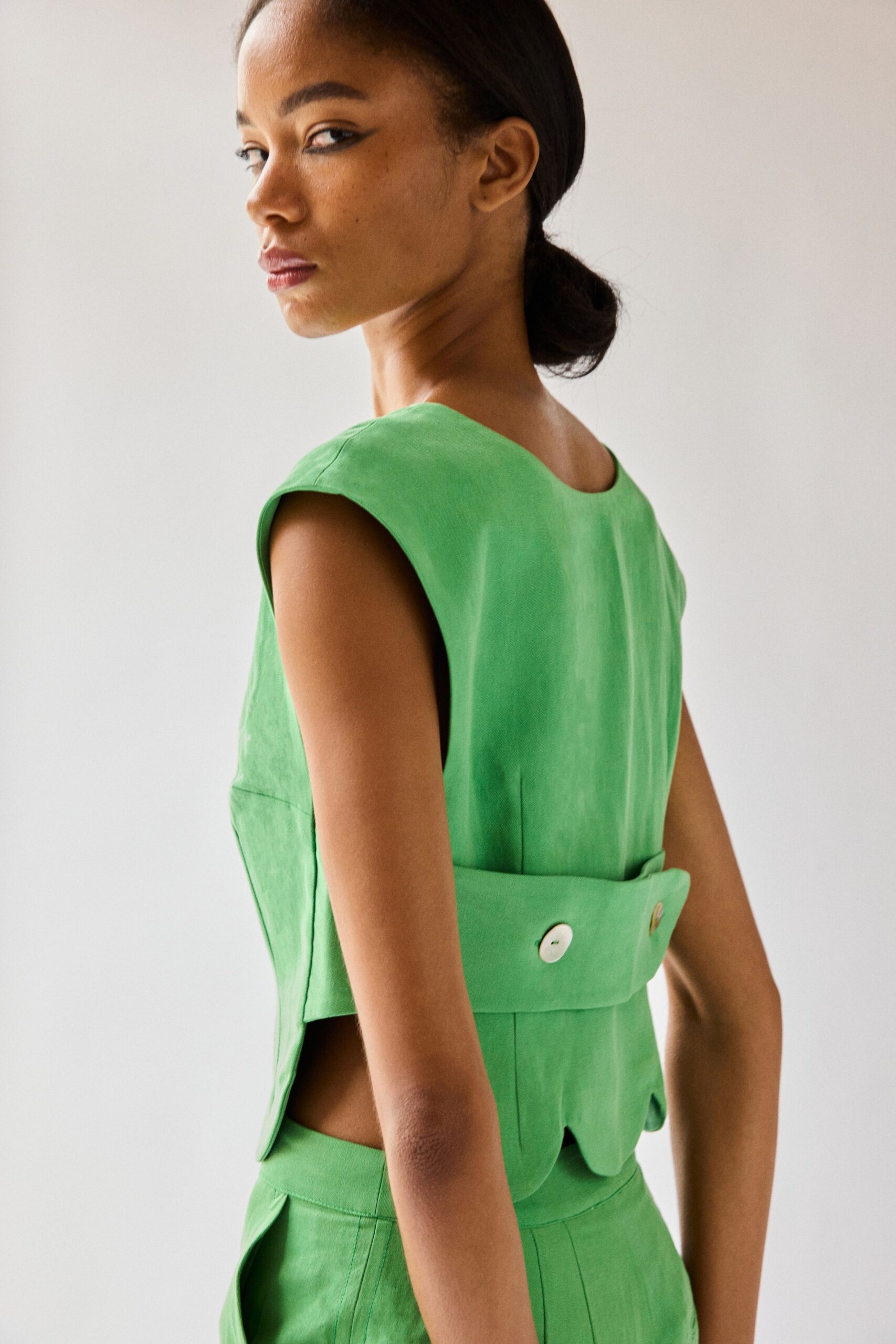 green open-back peplum top