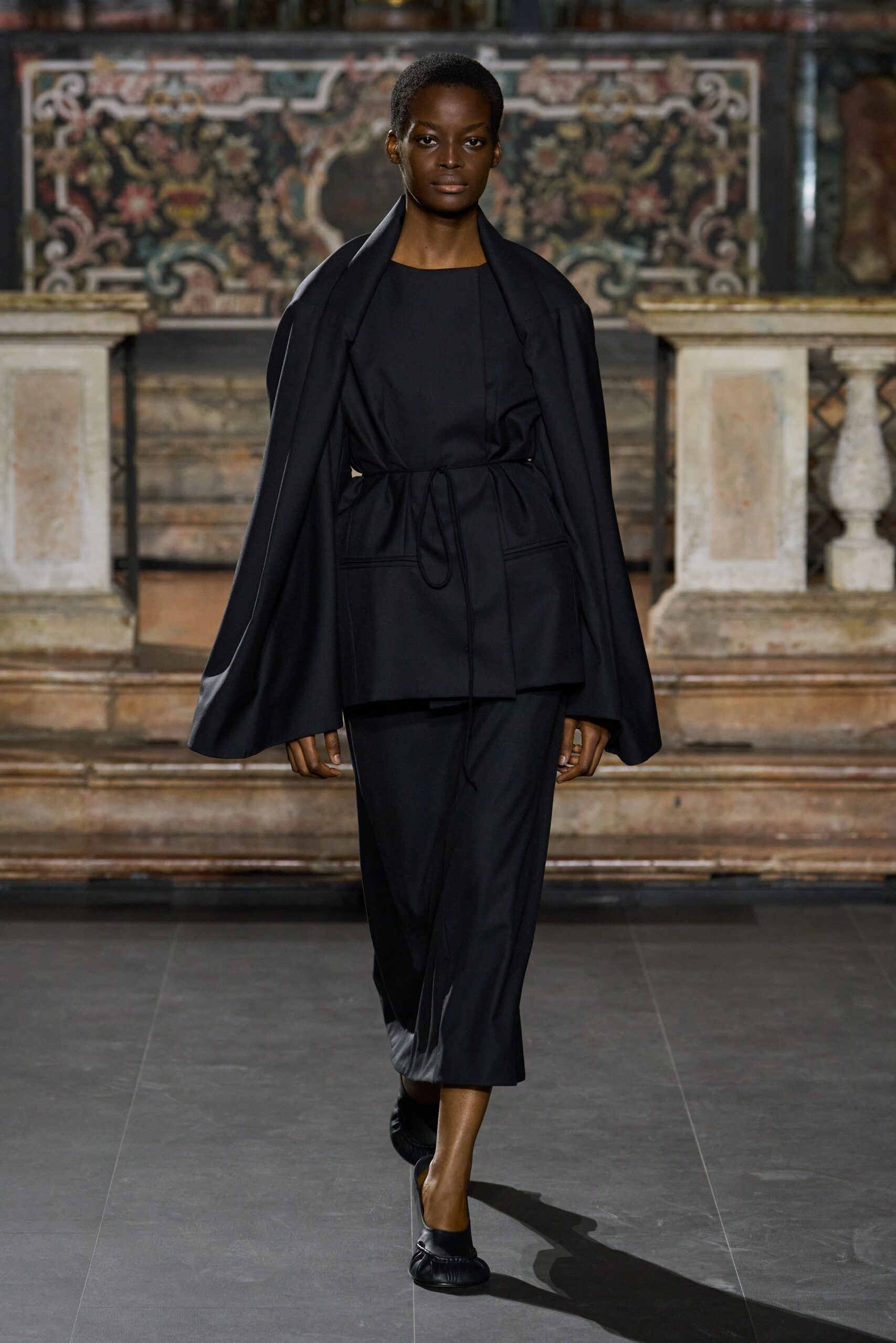 black draped shoulder cape