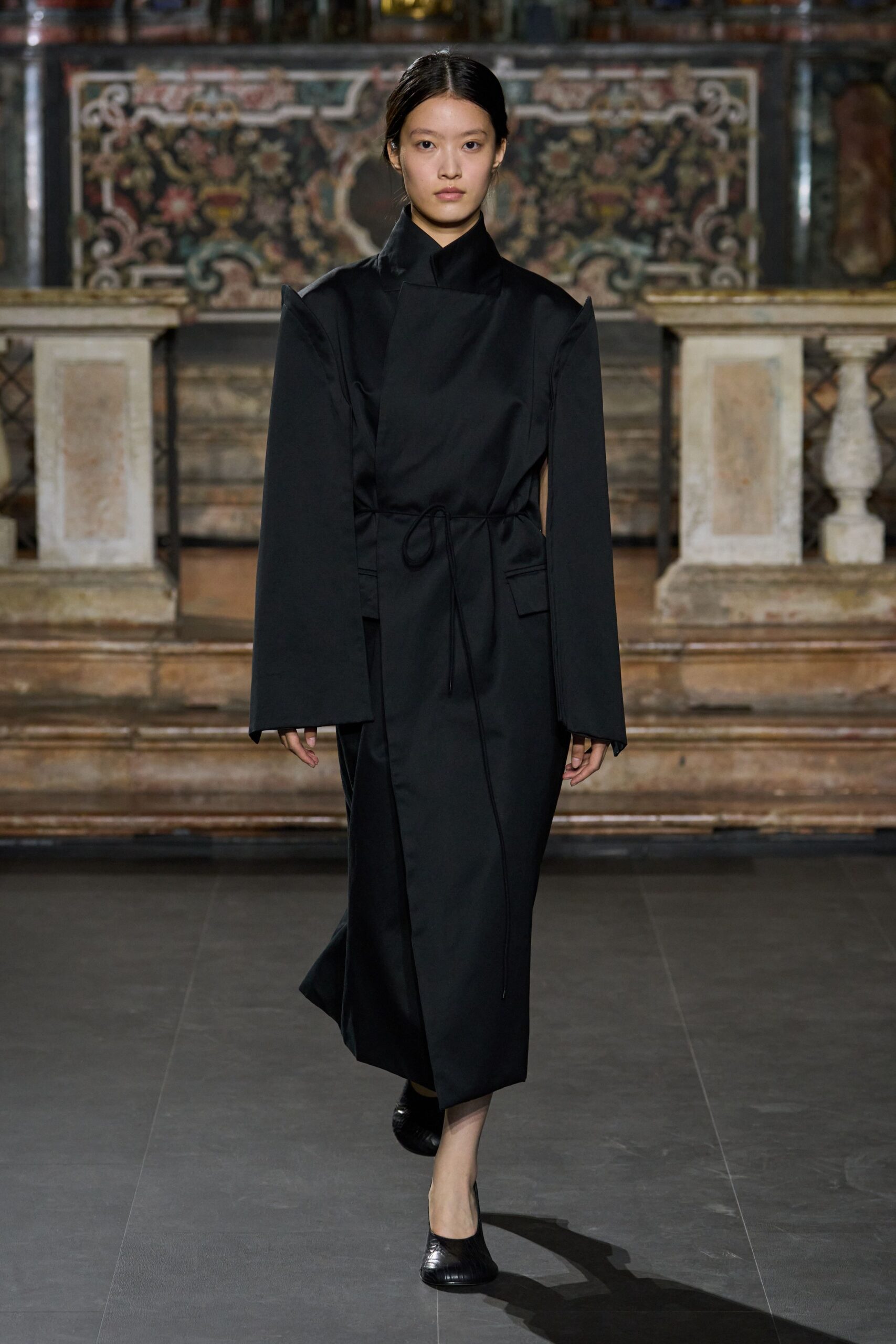 black cape-sleeve column dress