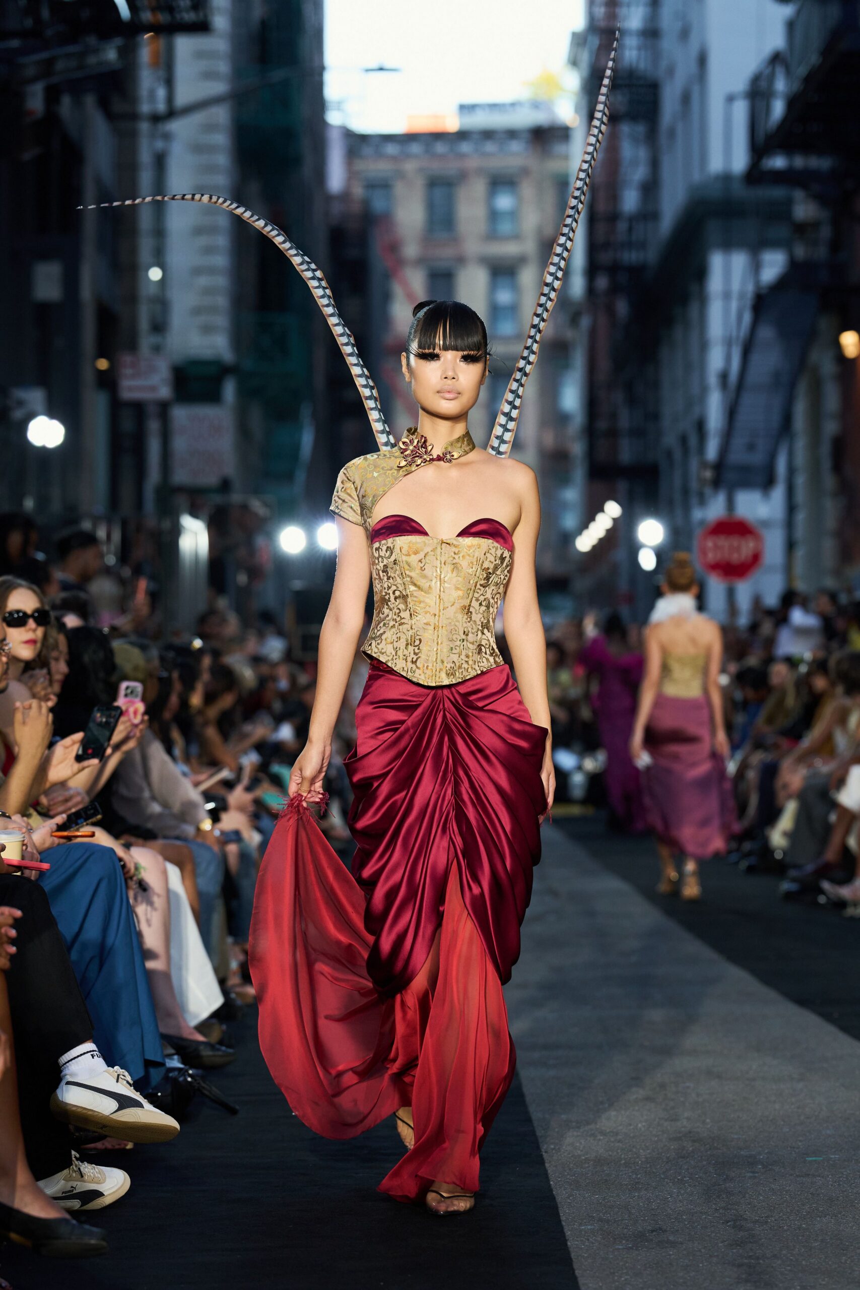 red satin off-shoulder sweetheart draped printed gown