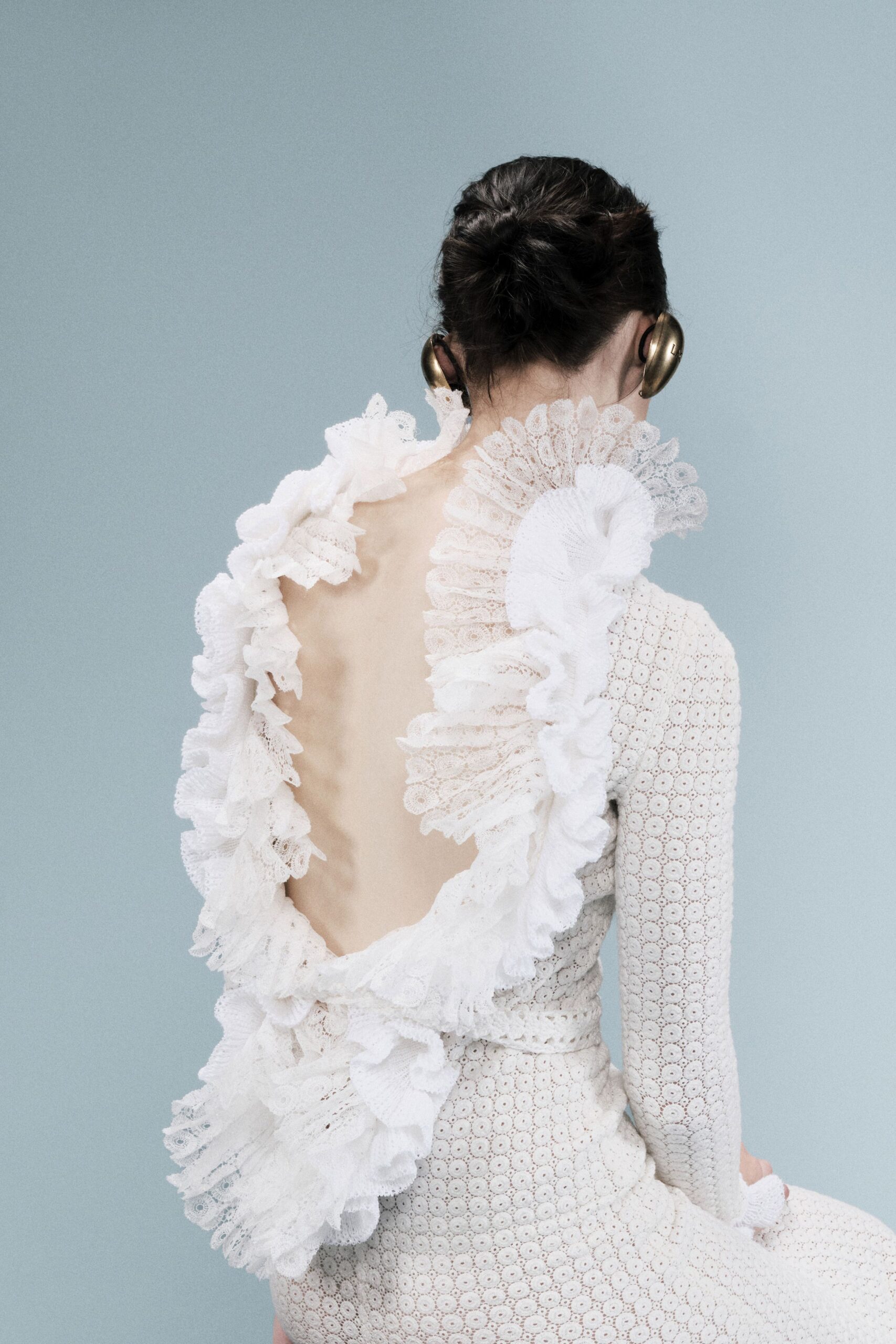 white backless ruffled lace gown