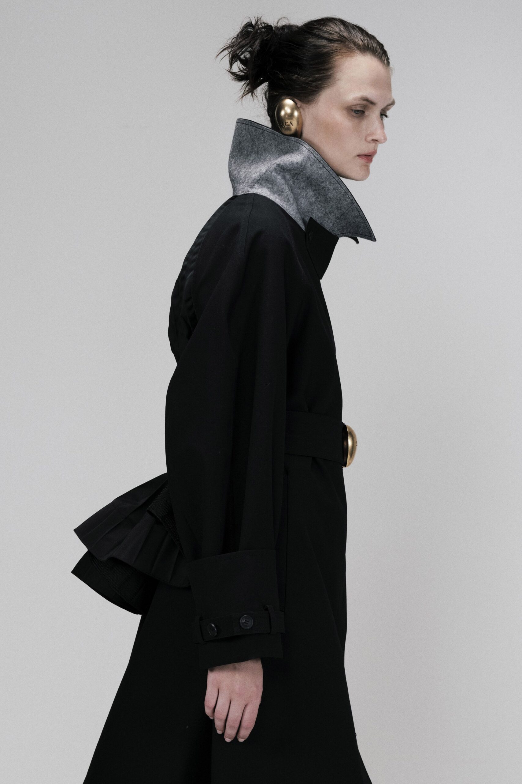 black coat with sculptural collar