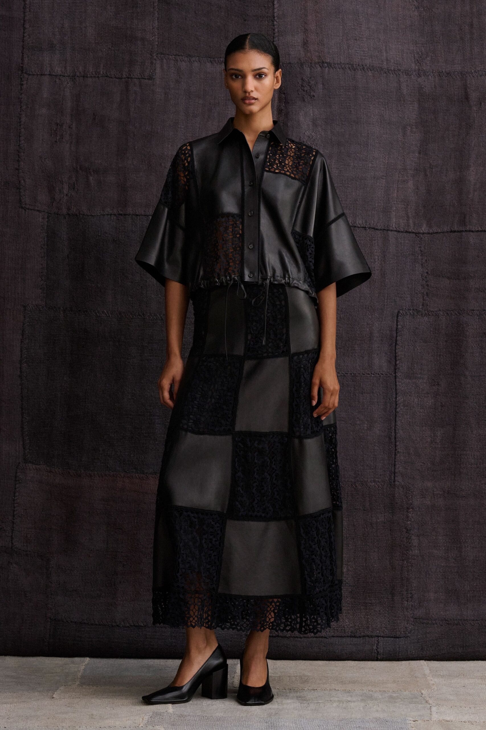 black leather panelled openwork textured midi skirt