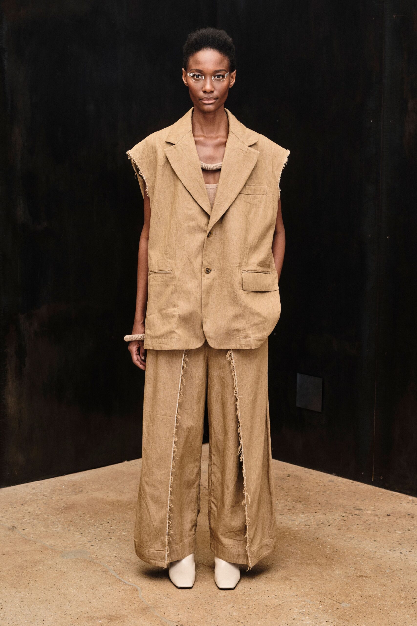 raw-edge sleeveless linen blazer
