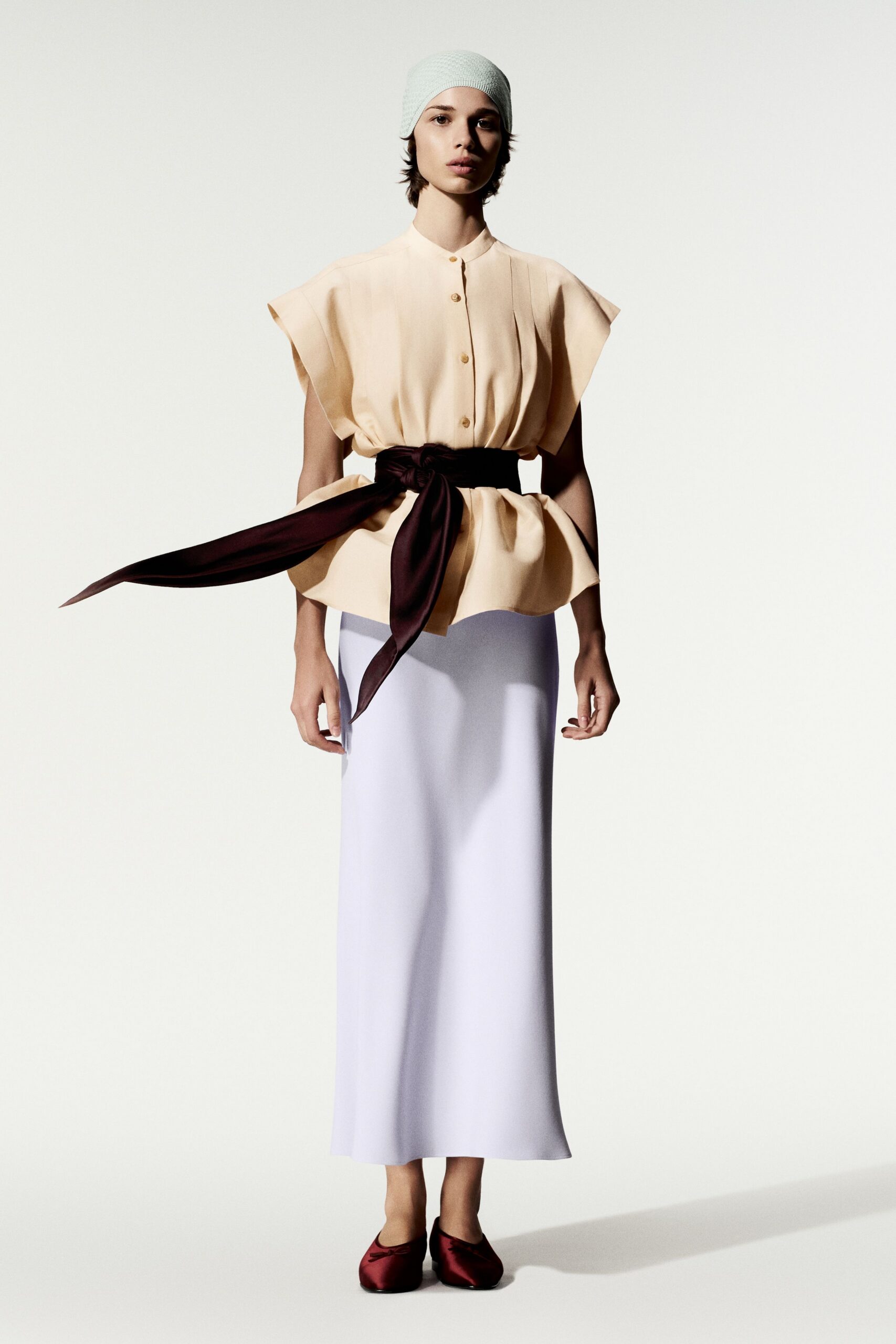 beige unknown high-neck sleeveless buttoned draped flowing blouse