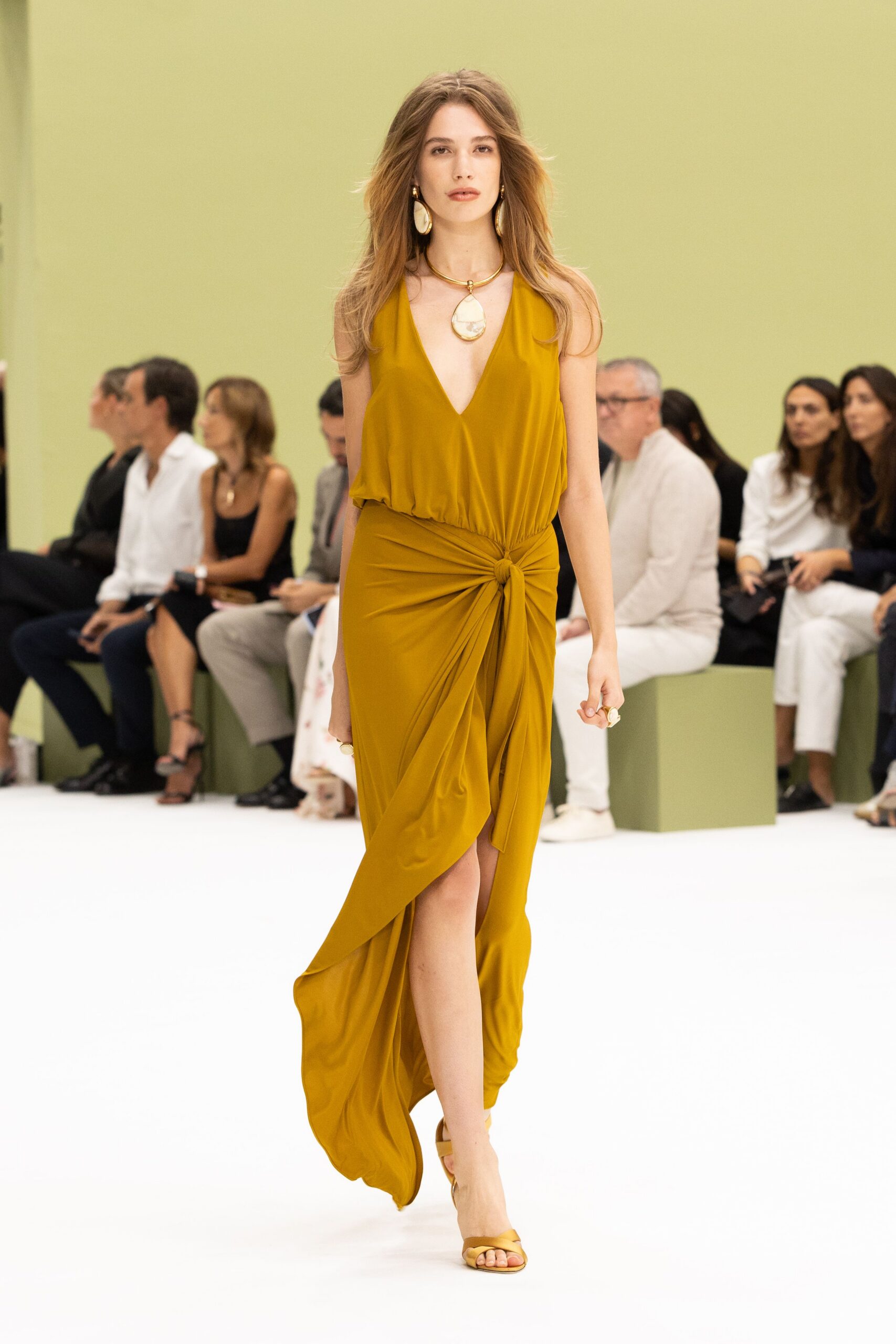 yellow jersey sleeveless v-neck draped knotted flowing gown