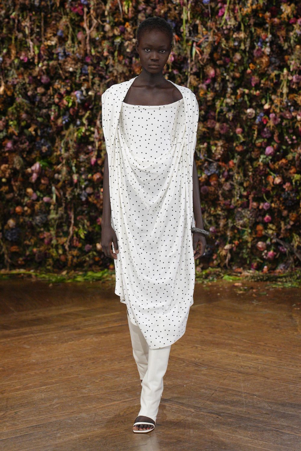 white polka-dot draped maxi dress