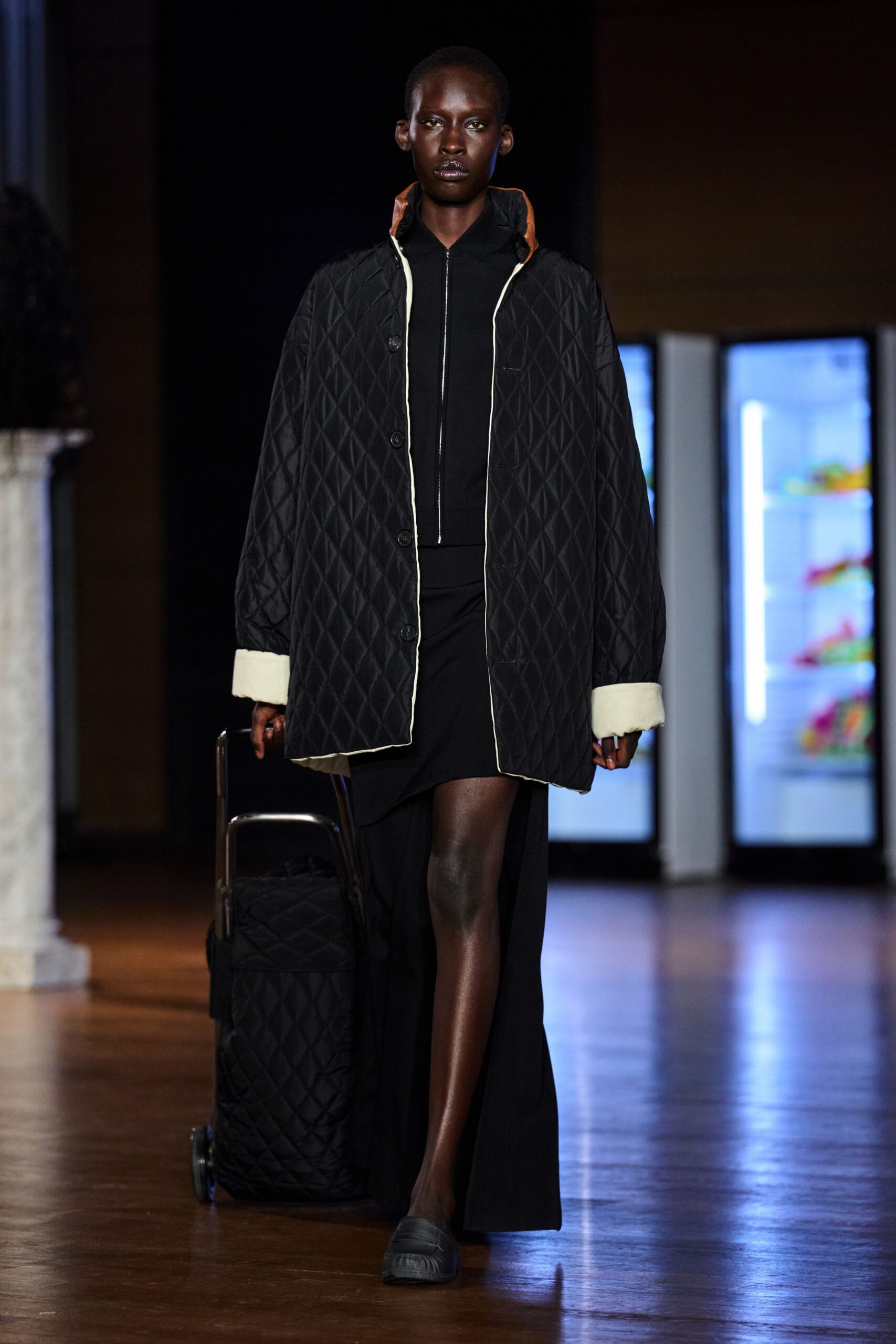black nylon long-sleeve collared oversized quilted buttoned coat