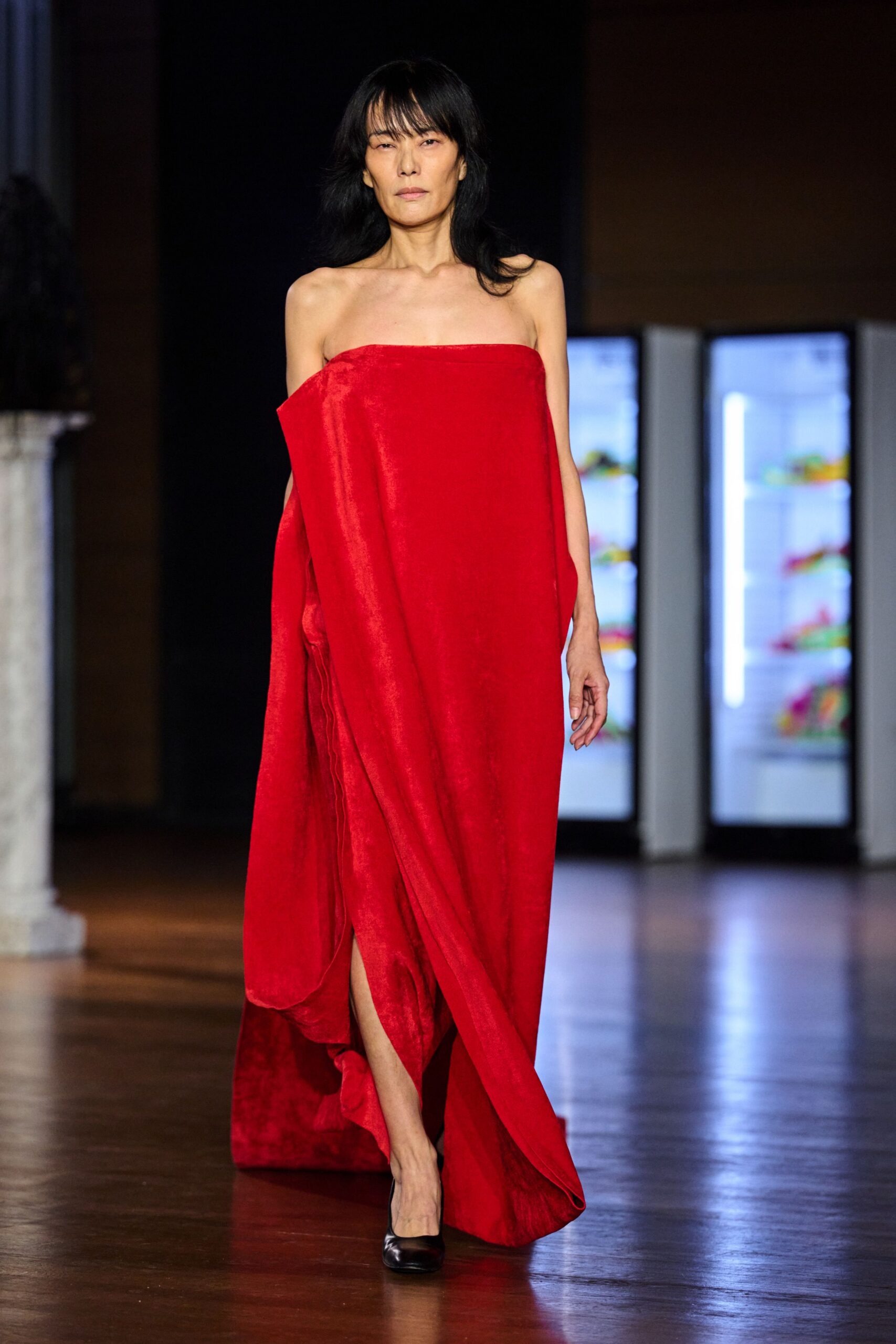 red strapless draped evening gown