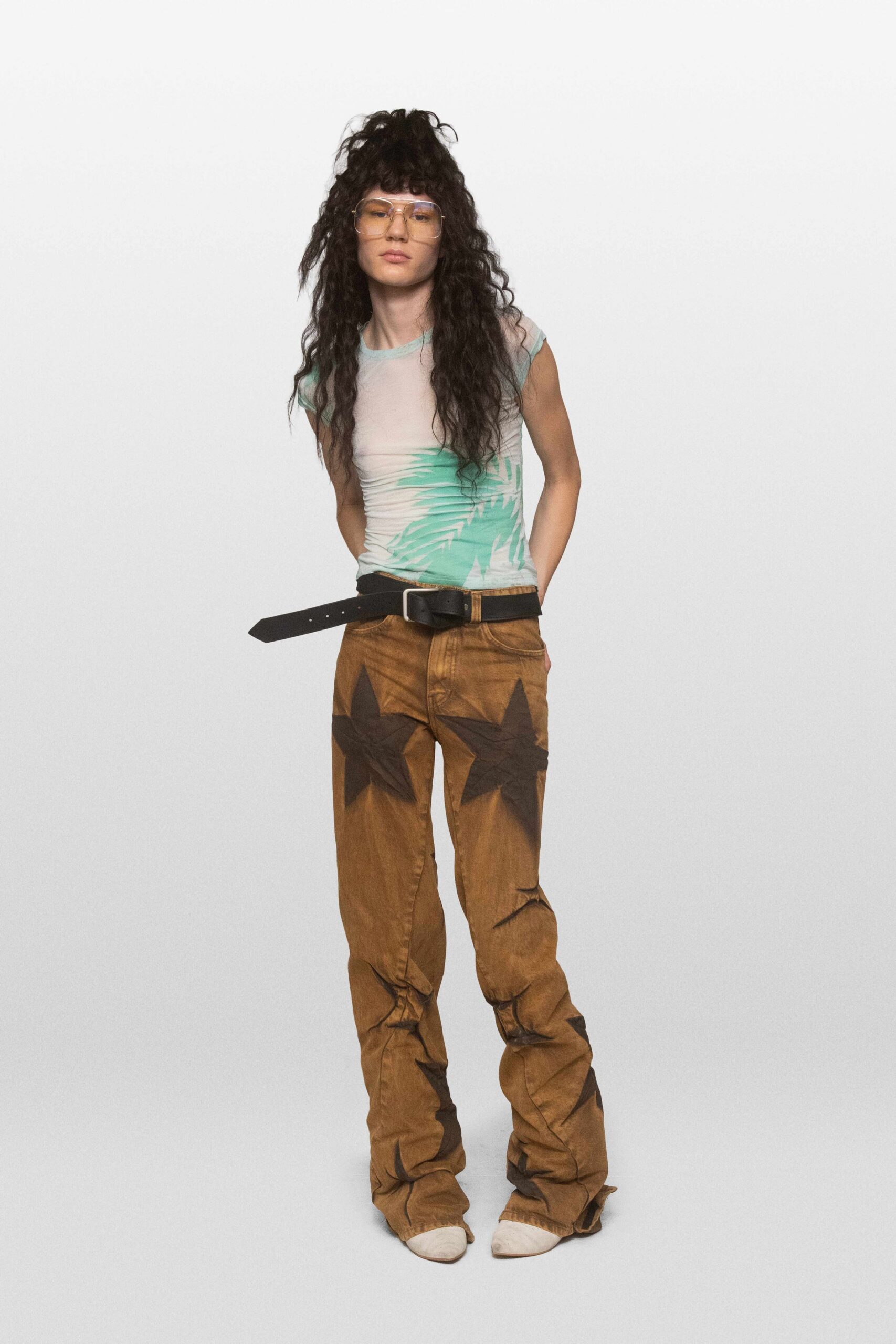 star-print brown trousers