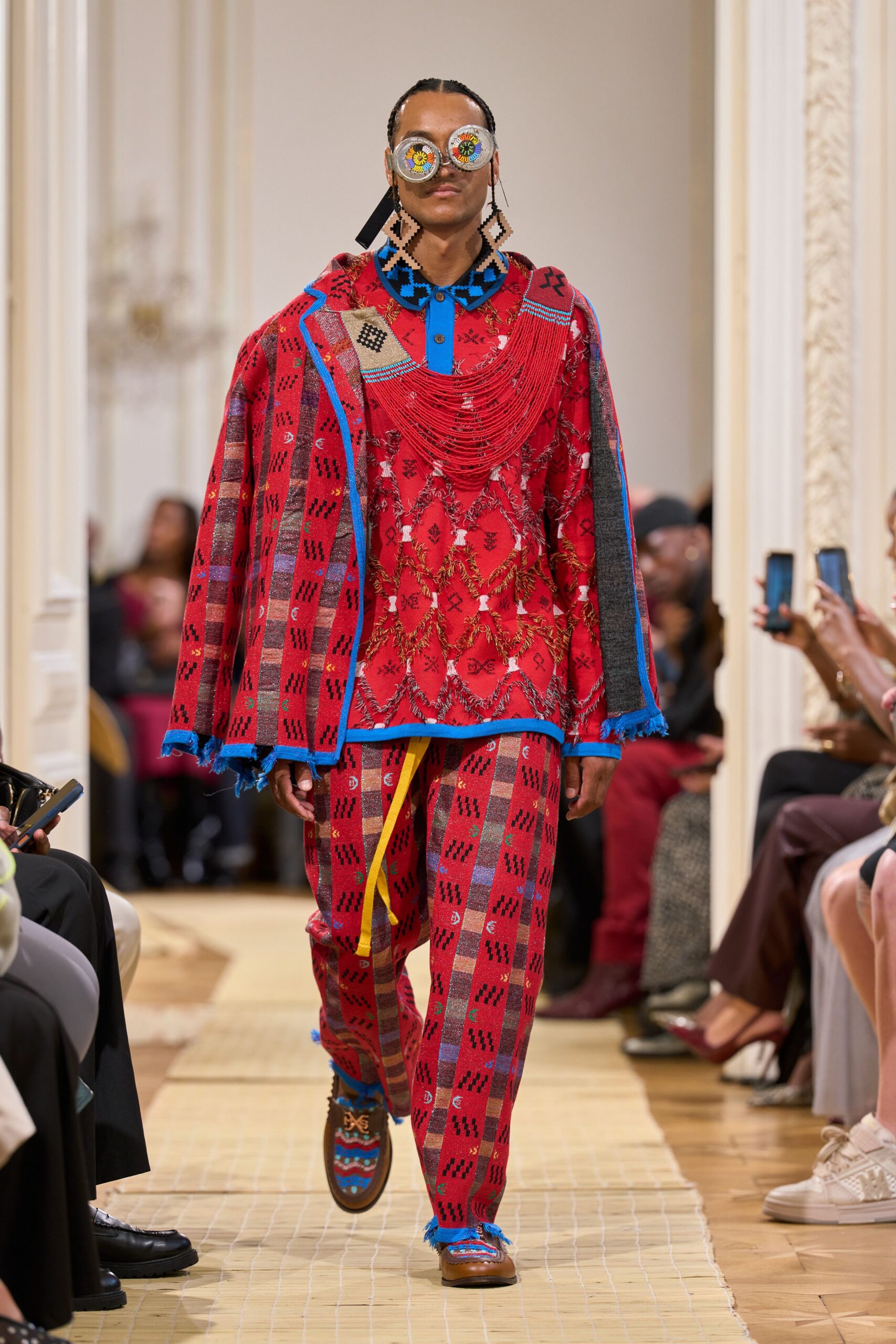 red patterned blanket poncho