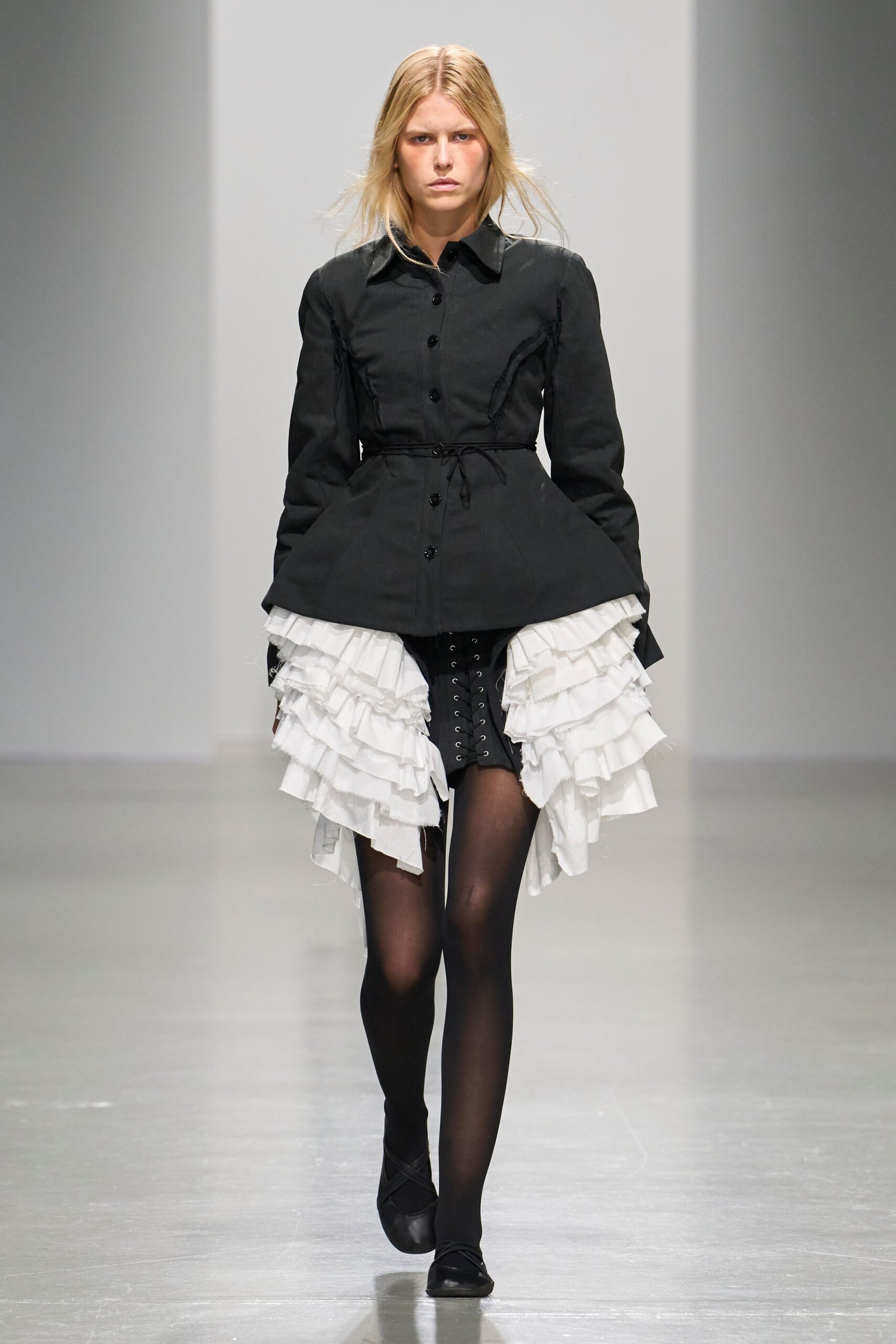 black peplum jacket with bustle skirt