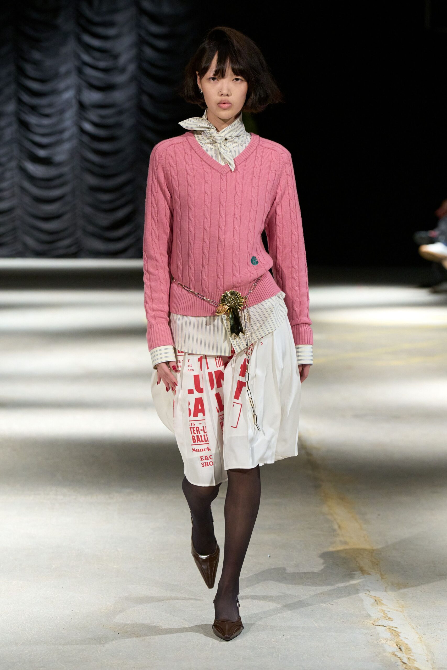 pink cable-knit v-neck sweater
