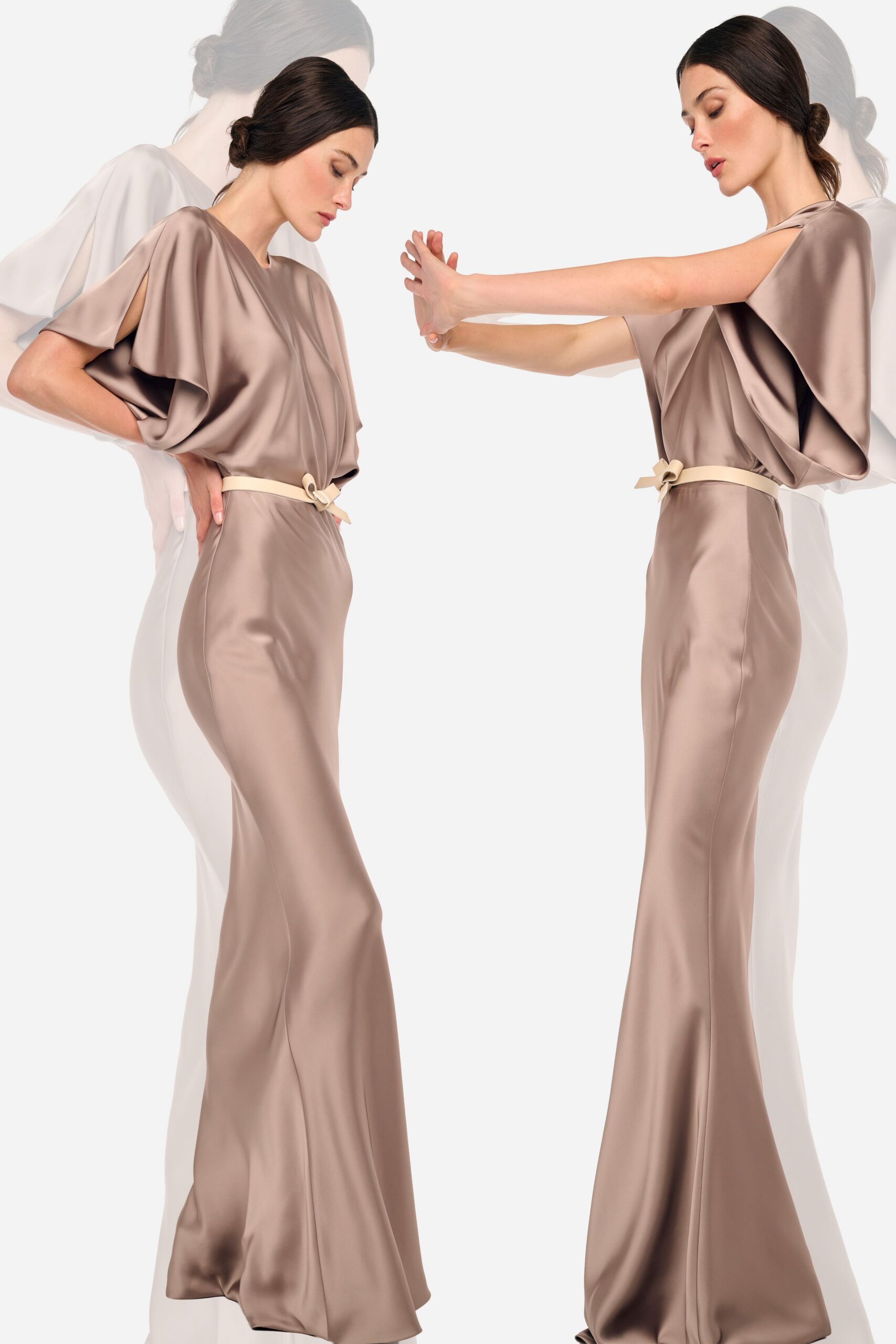 Taupe satin column gown with deep split sleeves and a softly bloused bodice. Narrow ivory belt tied off-center in a small folded bow. For the hotel ballroom before anyone has started speaking.