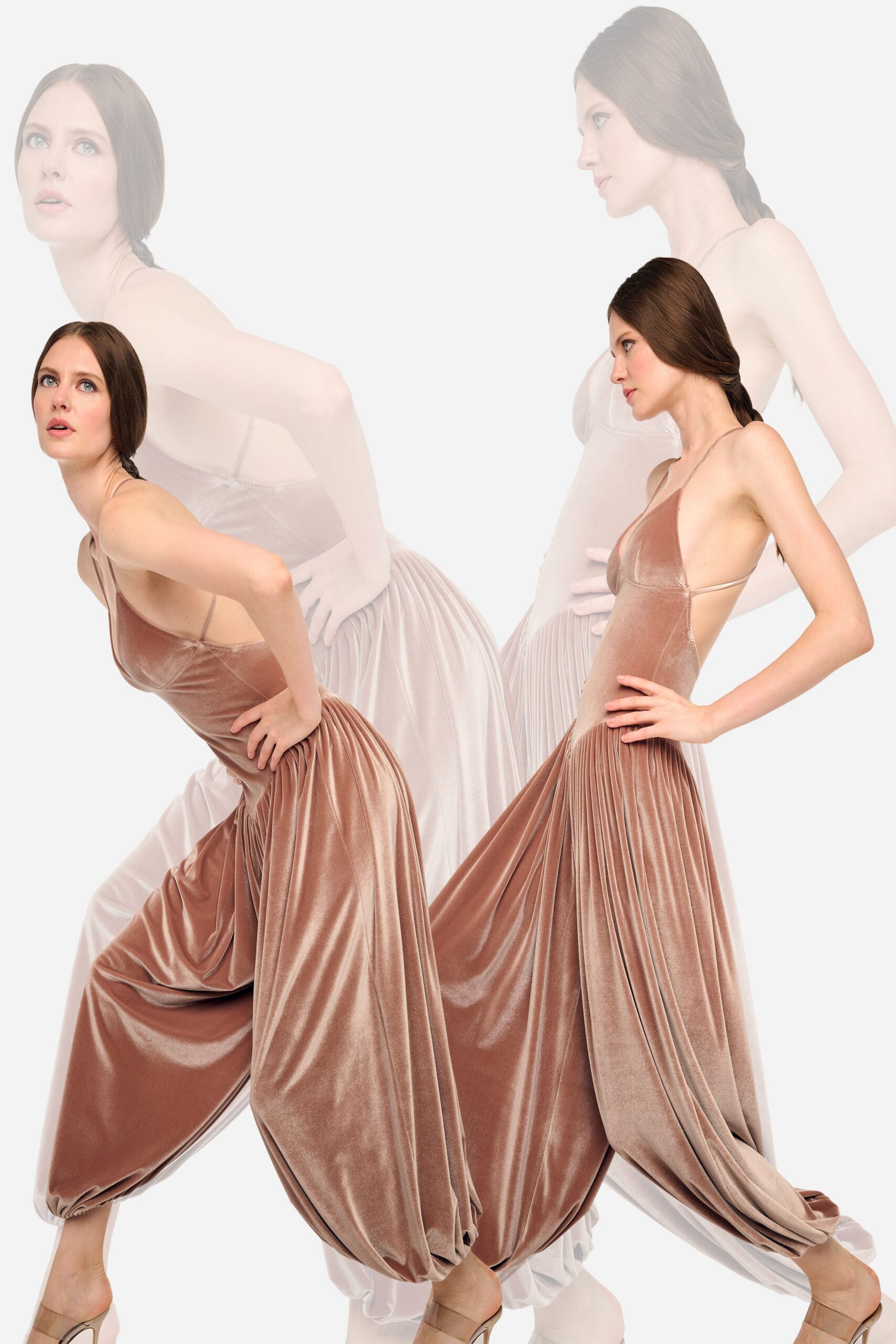 Blush velvet jumpsuit with a deep halter V and sharply seamed cups. Knife-pleated from the dropped waist, ballooning into pooled draped volume. Clear-strap heeled mules. For crossing a hotel ballroom after midnight with the band still packing up.