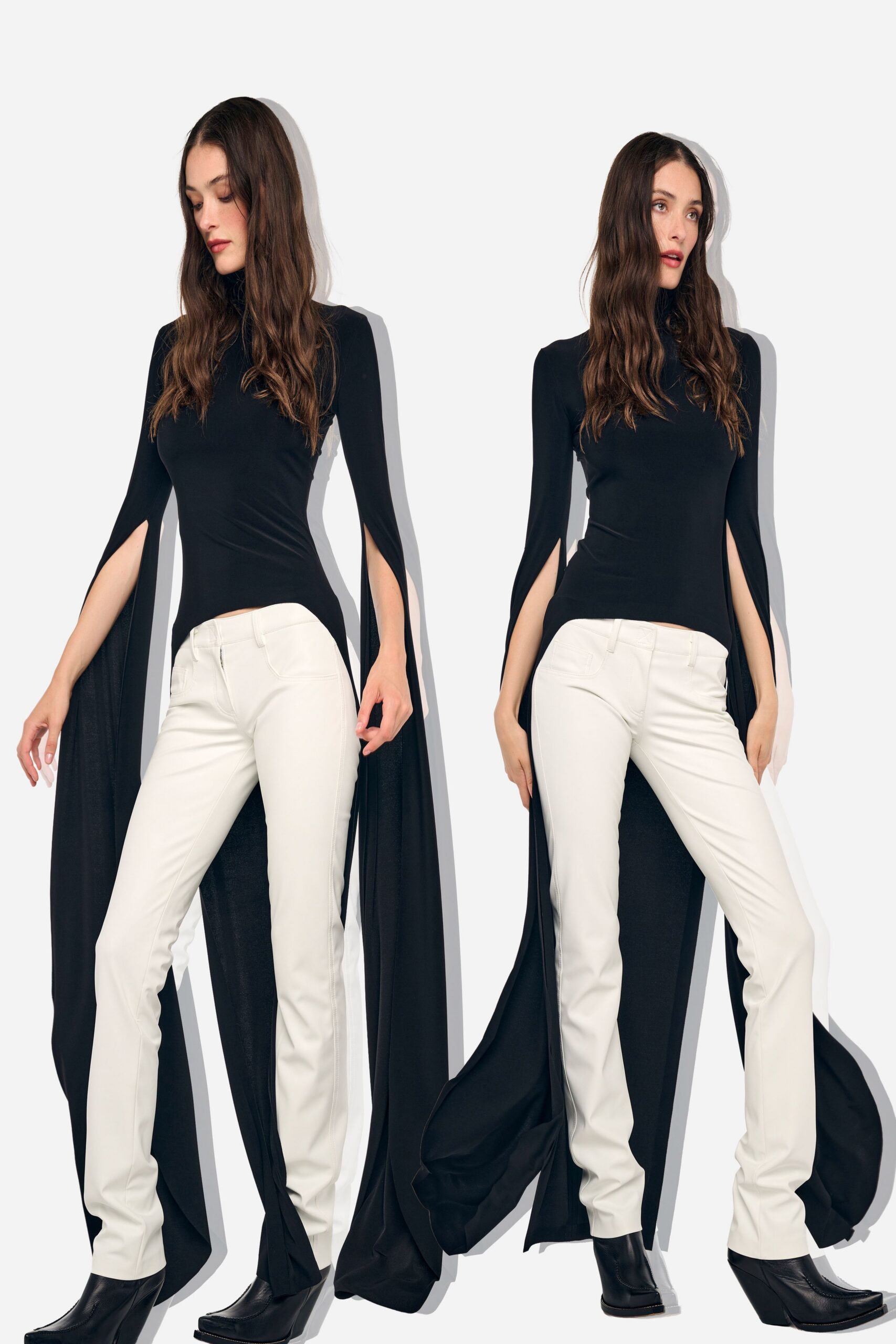 Black jersey mock-neck top with cape sleeves split from shoulder to wrist. Cream low-rise trousers, seamed straight through the leg with square patch pockets. Black leather ankle boots with a pointed toe and stacked heel. For crossing a hotel lobby while the revolving door keeps catching cold air.