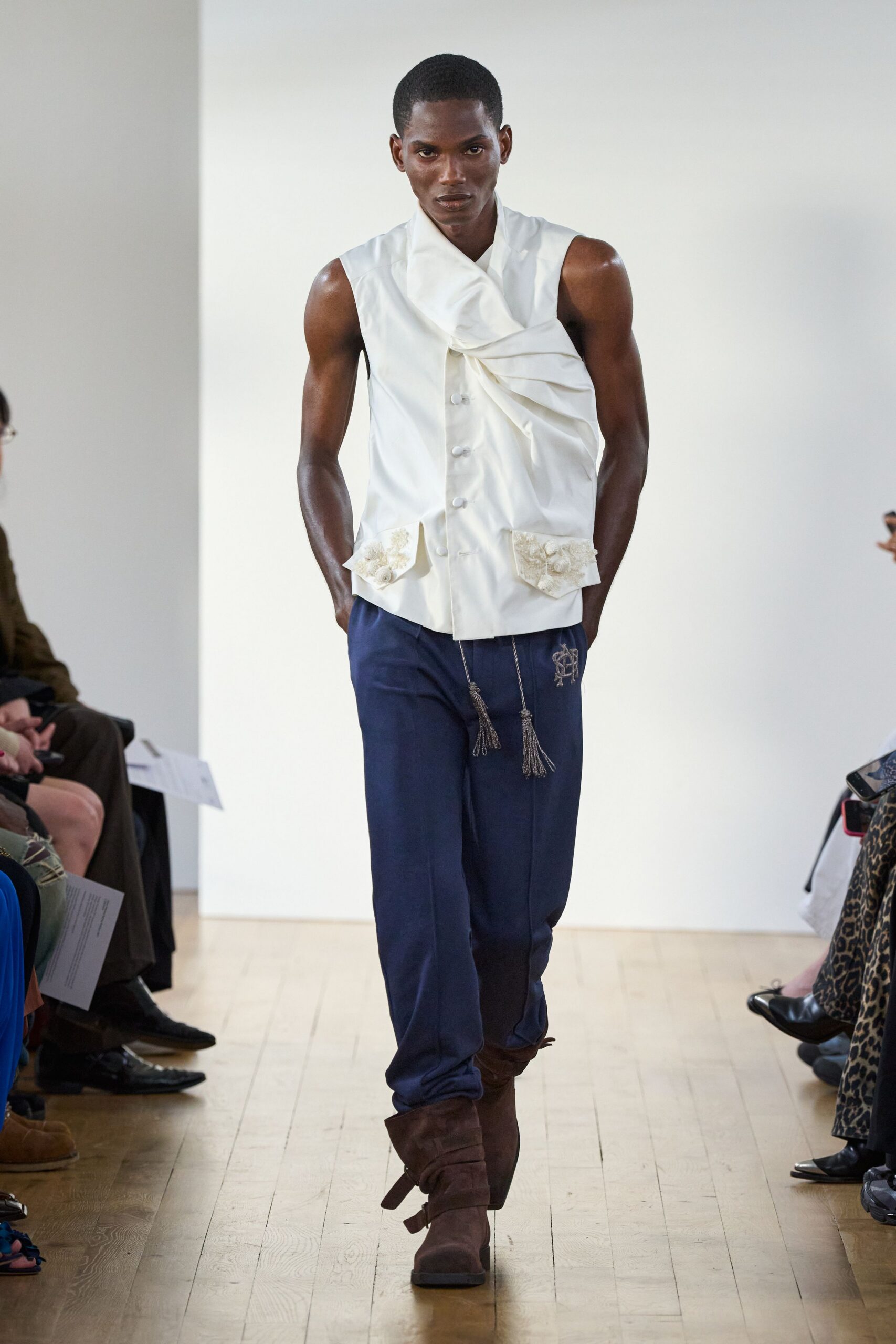 draped white sleeveless vest