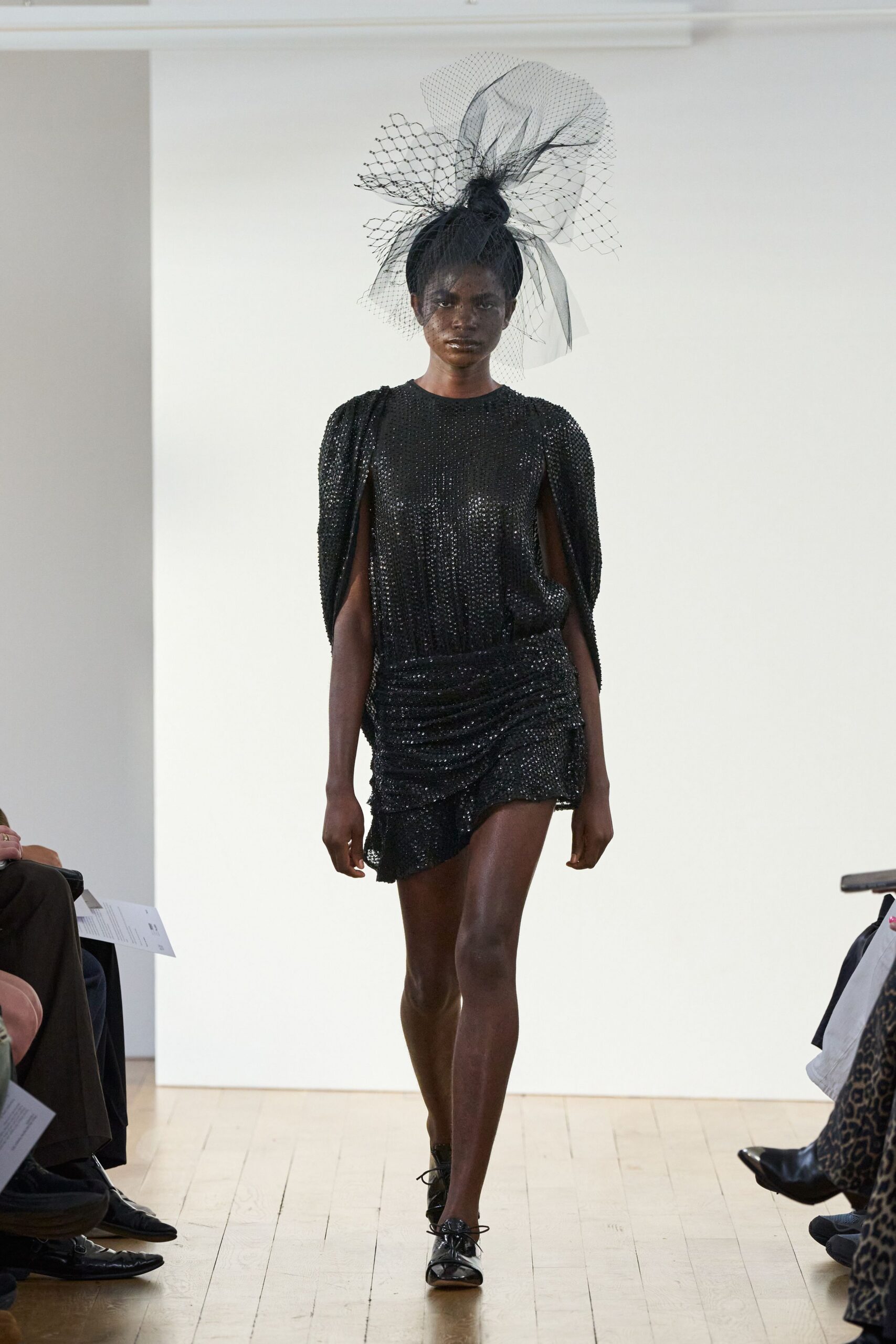 black sequined cape-sleeve mini dress