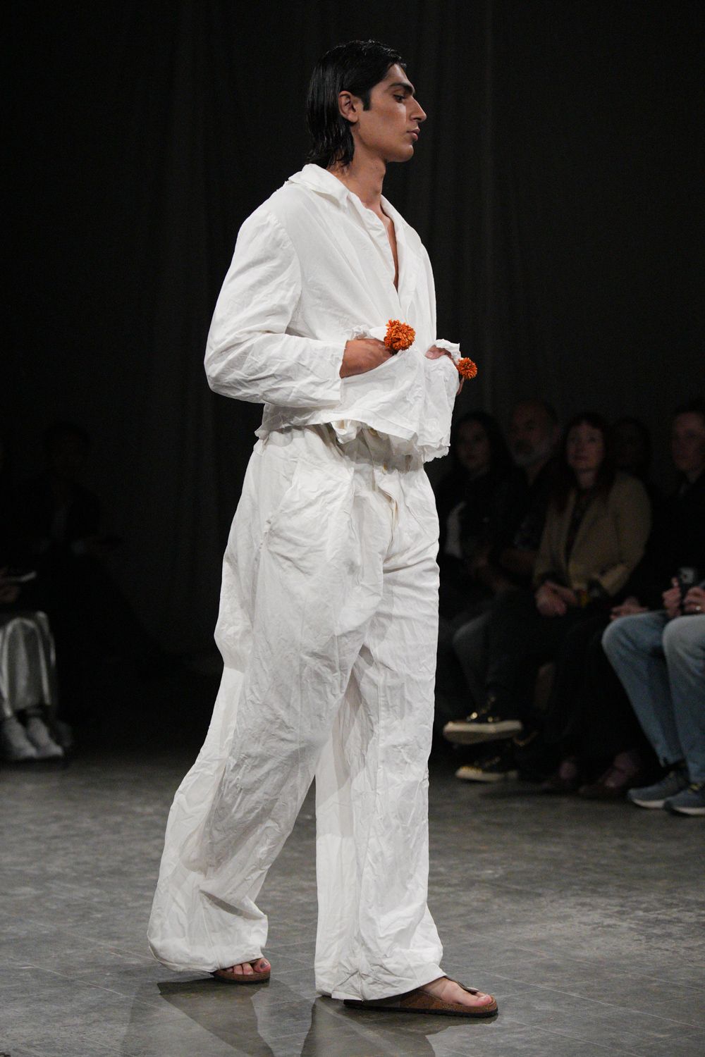 crinkled white wide-leg trousers