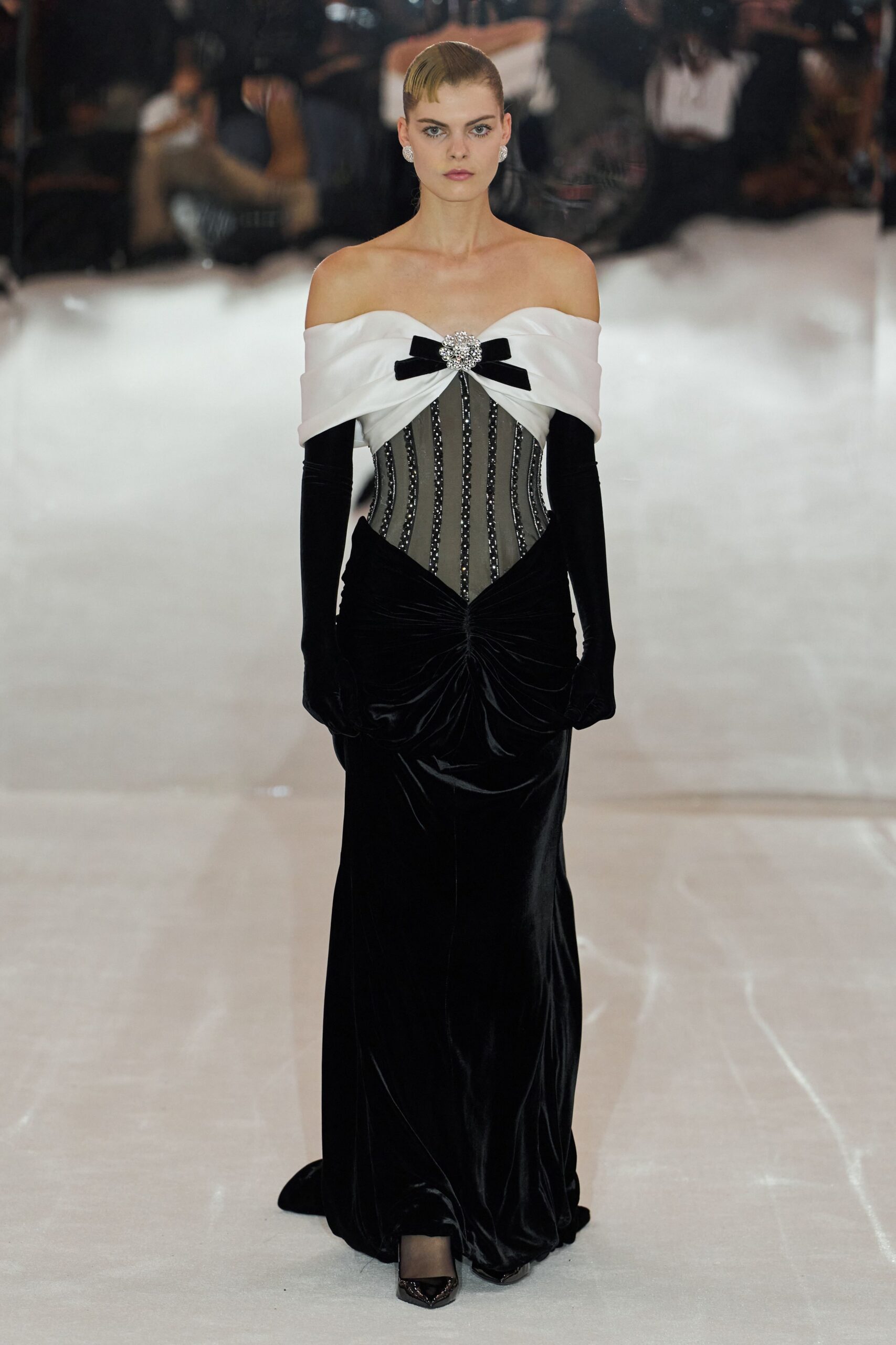 off-shoulder corseted velvet evening gown