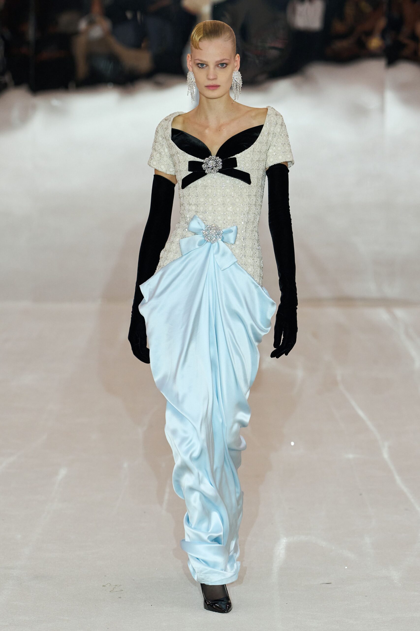 blue draped evening gown with bows