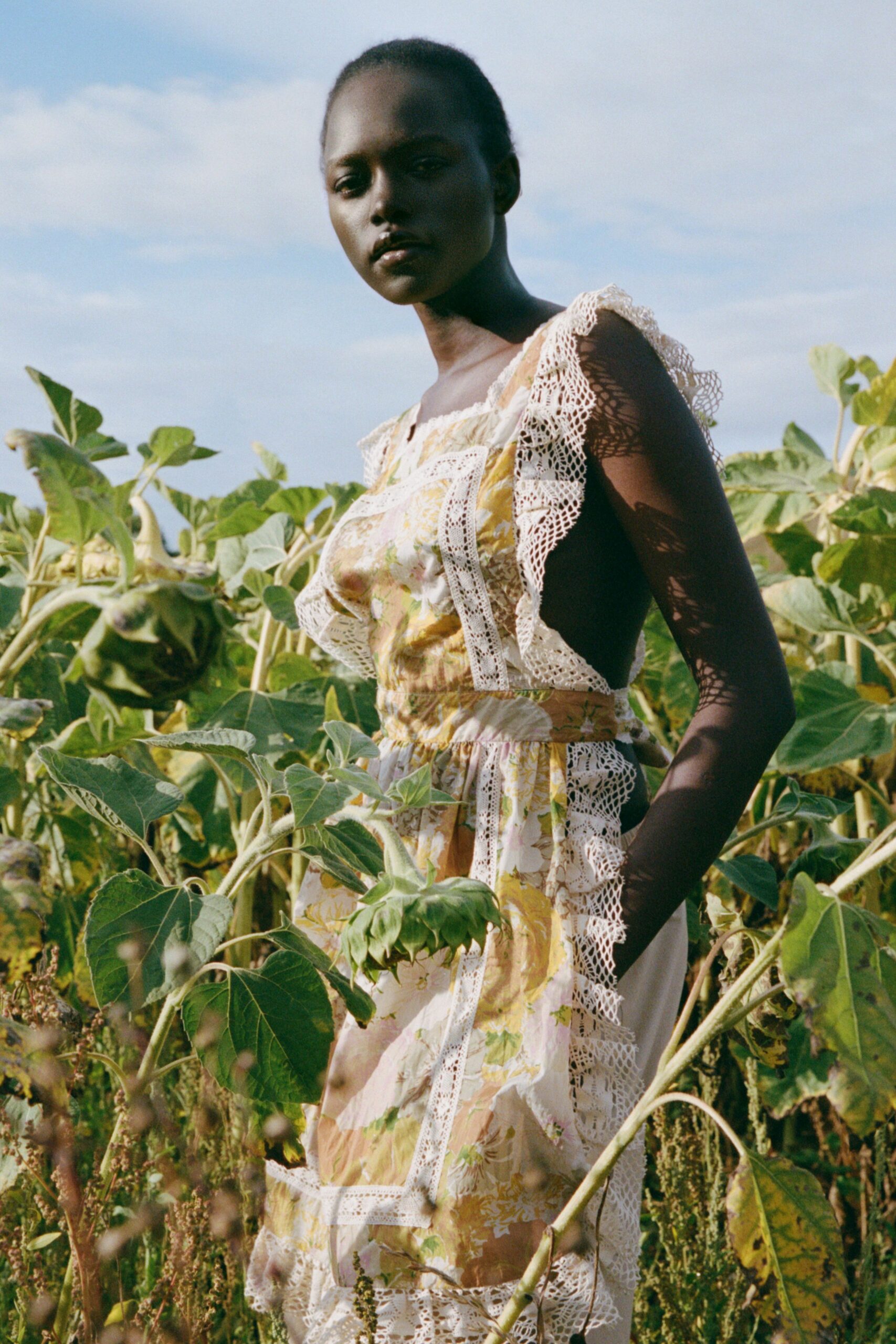 Sun-faded floral dress spliced with cream crochet bands and deep open sides. Standing in a sunflower field after the heads have already dropped.