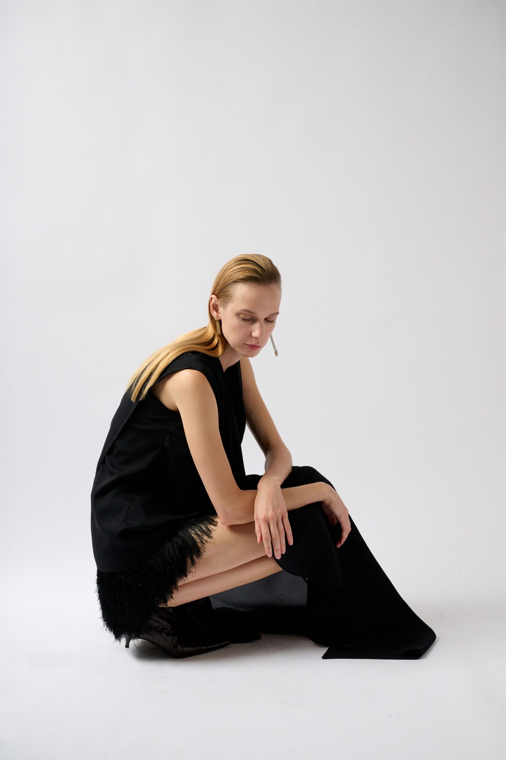 black feather-trim evening gown