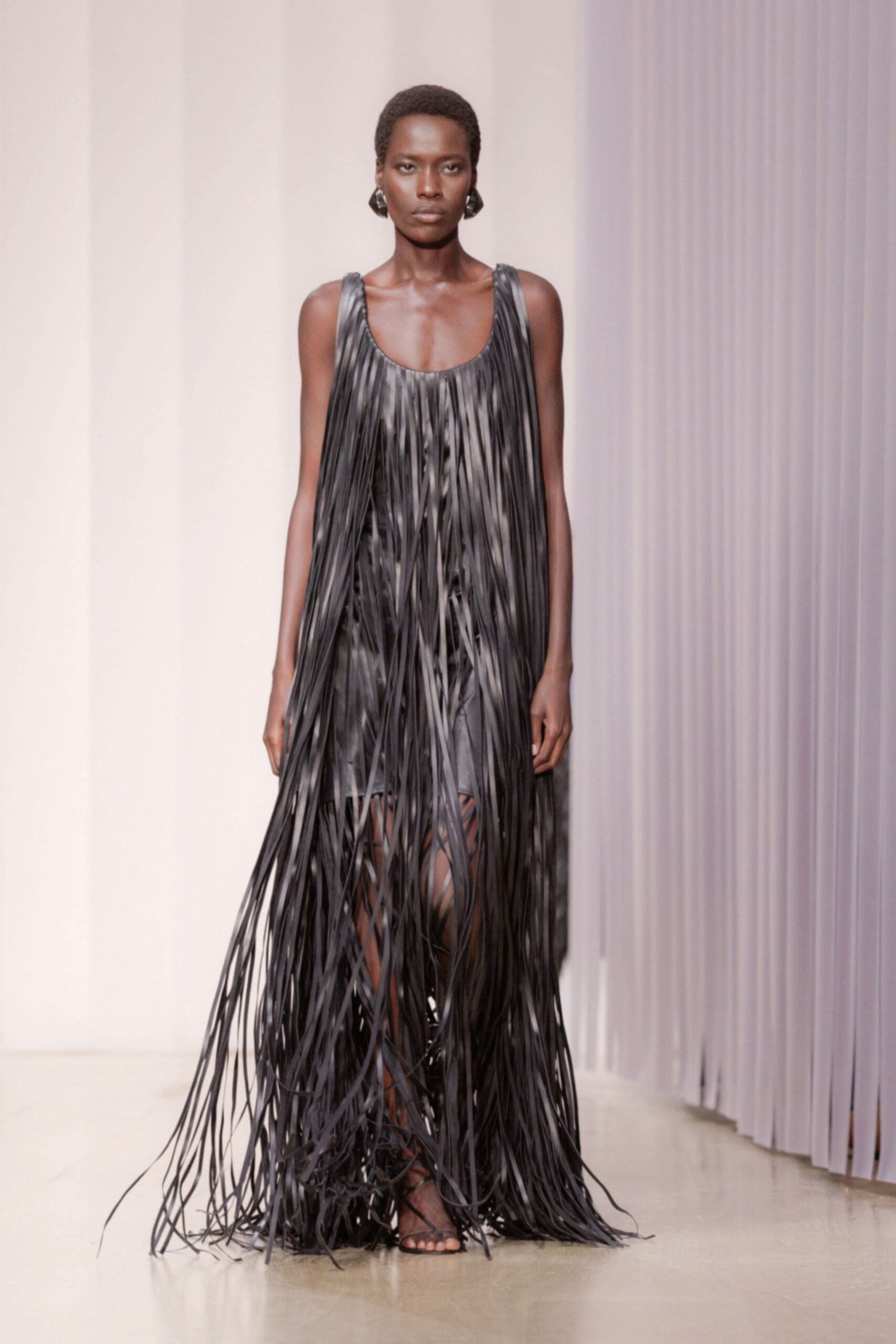 black leather sleeveless scoop-neck fringed shiny flowing maxi-dress