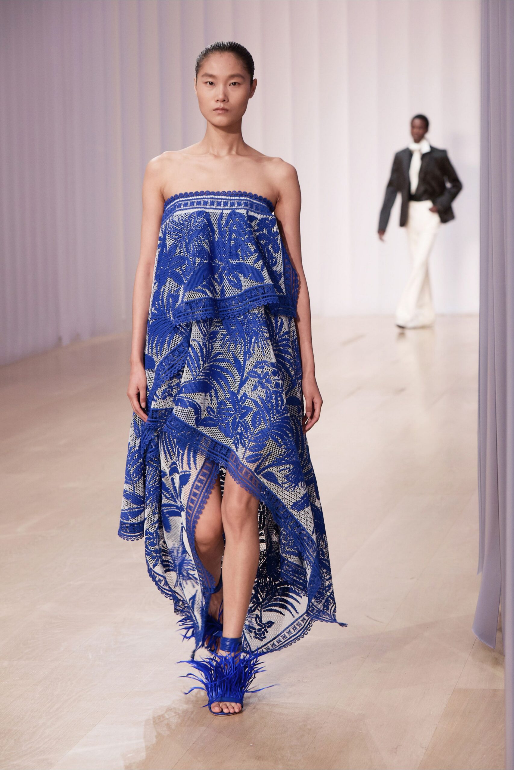 blue lace strapless asymmetric floral draped gown