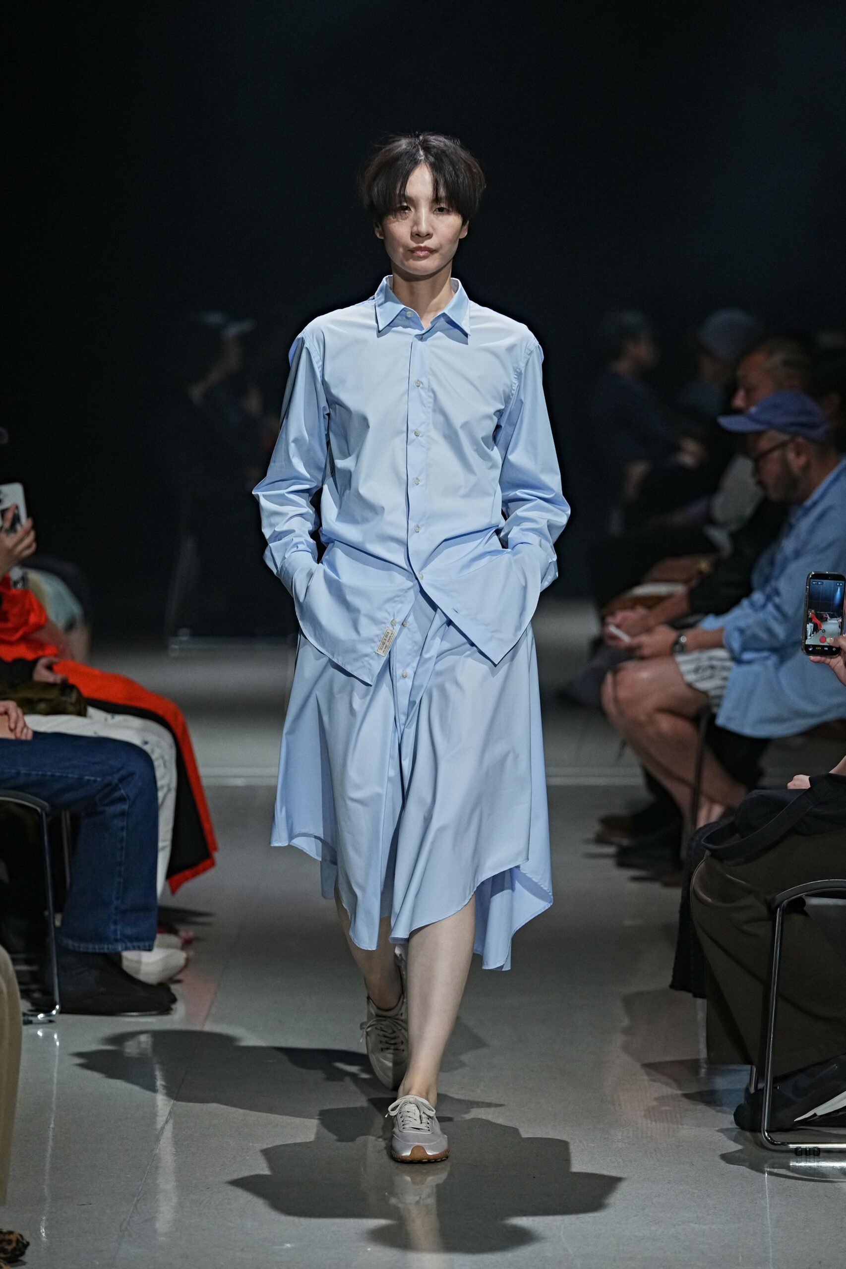 Pale blue poplin shirt dress with a second waist opening cut through front. Pearly grey trainers with gum soles and fine tonal laces. Walking to buy coffee in the borrowed button-down you turned into a dress.