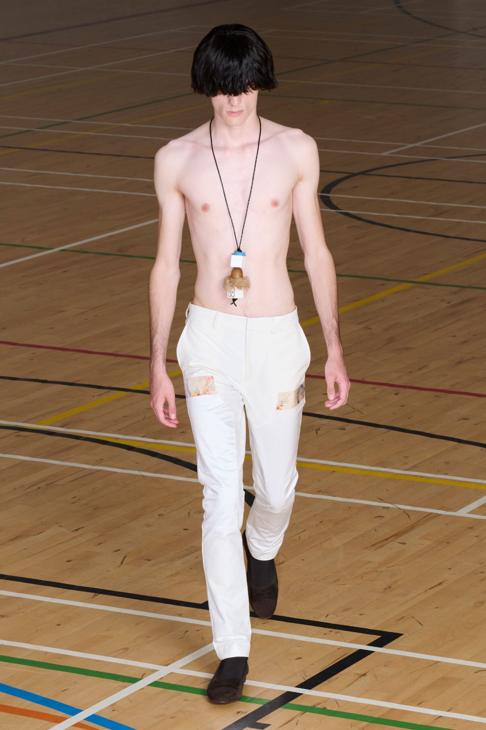 white trousers with printed patch inserts